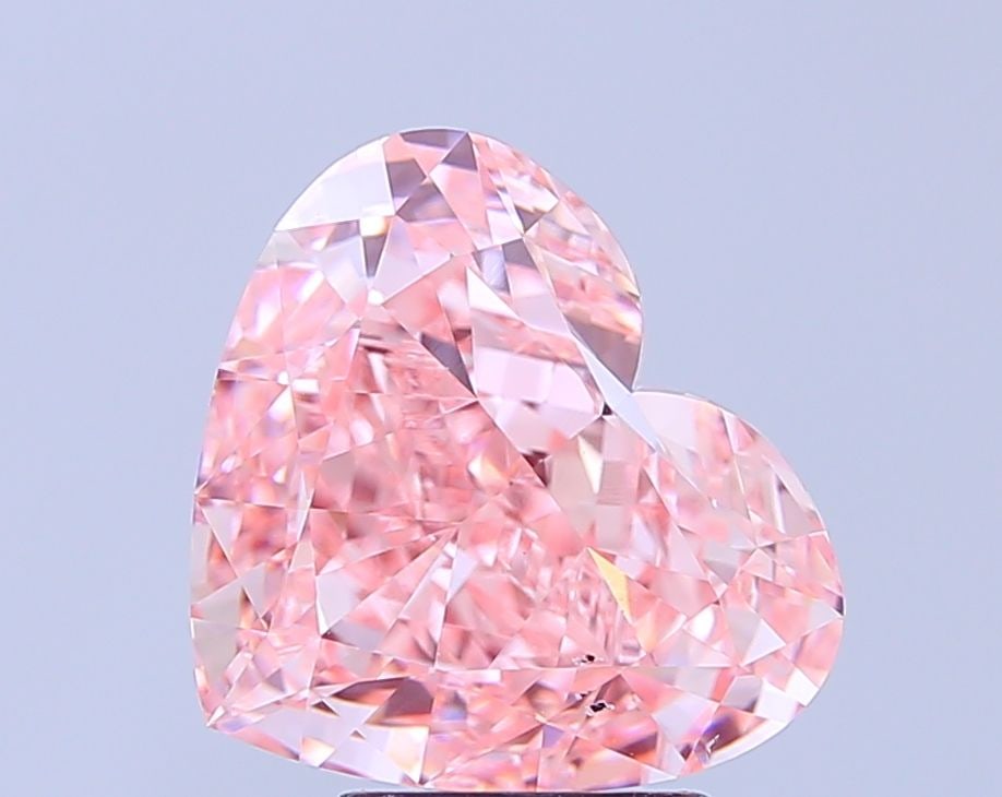 Loose Diamond - HEART 5.05ct Fancy Vivid Pink VS2: Loose Diamond - HEART 5.05ct Fancy Vivid Pink VS2 Source: This is a real non-mined Diamond that has been grown in a lab Shape: HEART Carats: 5.05 Color: Fancy Vivid Pink Certification: IGI Video: