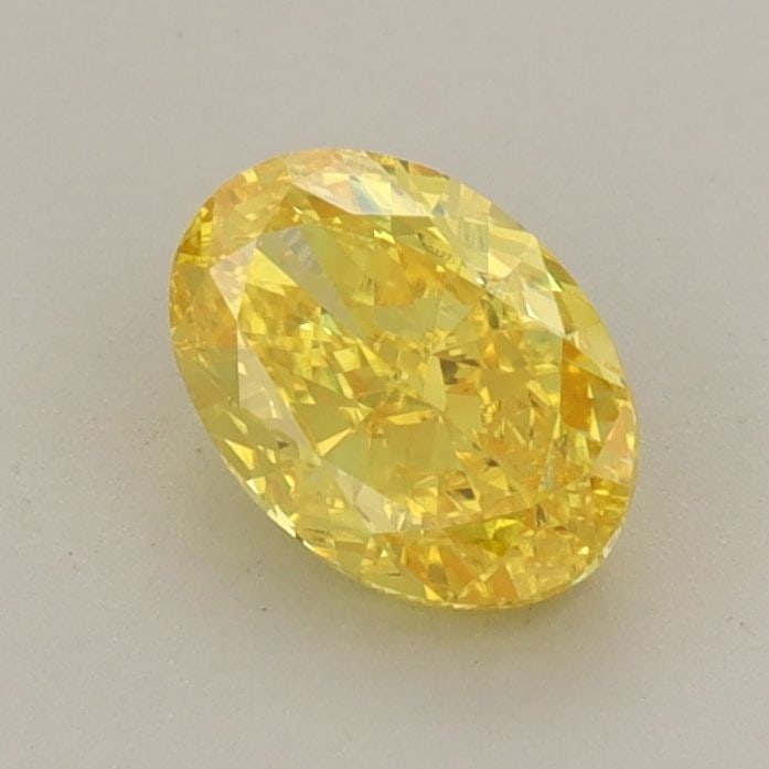 Loose Diamond - OVAL 0.83ct Fancy Vivid Yellow VVS2: Loose Diamond - OVAL 0.83ct Fancy Vivid Yellow VVS2 Source: This is a real non-mined Diamond that has been grown in a lab Shape: OVAL Carats: 0.83 Color: Fancy Vivid Yellow Certification: IGI Video: