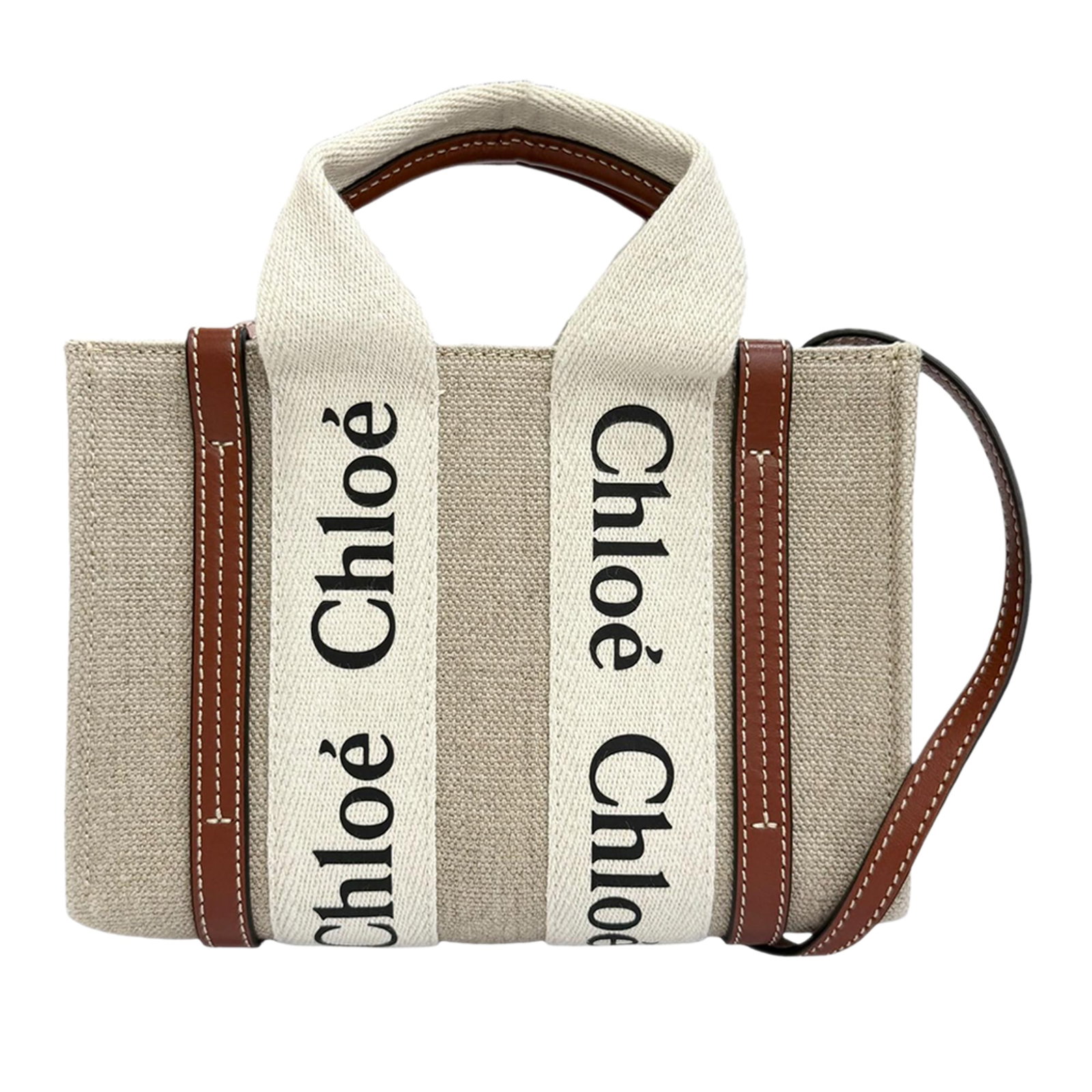 Chloe Woody Mini Canvas Satchel Bag with Leather Strap: Chloe Woody Mini Canvas Satchel Bag with Leather Strap A Chloe Mini Woody satchel crafted in canvas with leather handle details and a detachable flat leather strap. This compact bag has an open top an