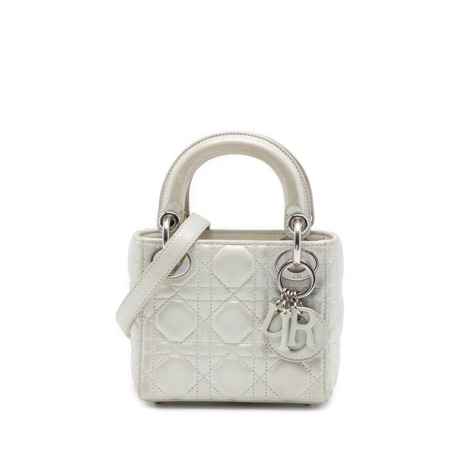 Dior Lady Dior Micro Bag Iridescent Lambskin Cannage Silver: Dior Lady Dior Micro Bag Iridescent Lambskin Cannage Silver A compact Lady Dior bag crafted in iridescent lambskin leather with the Cannage quilted design. This micro bag features flat leather top han