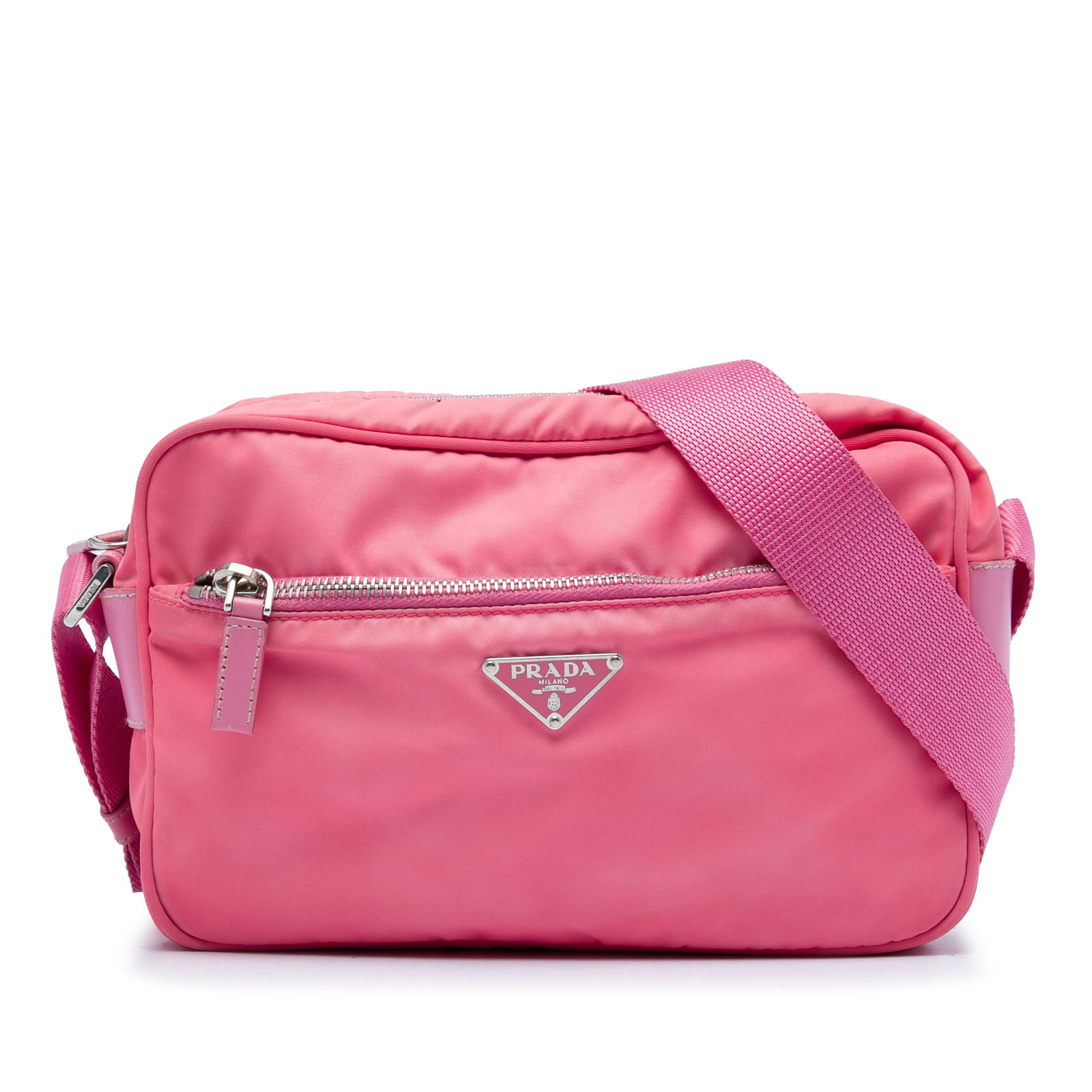 Prada Tessuto Camera crossbody bag in pink nylon: Prada Tessuto Camera crossbody bag in pink nylon Prada Tessuto Camera Bag in pink fabric with a compact crossbody design. It features an adjustable flat strap, top zip closure, front exterior zip pock