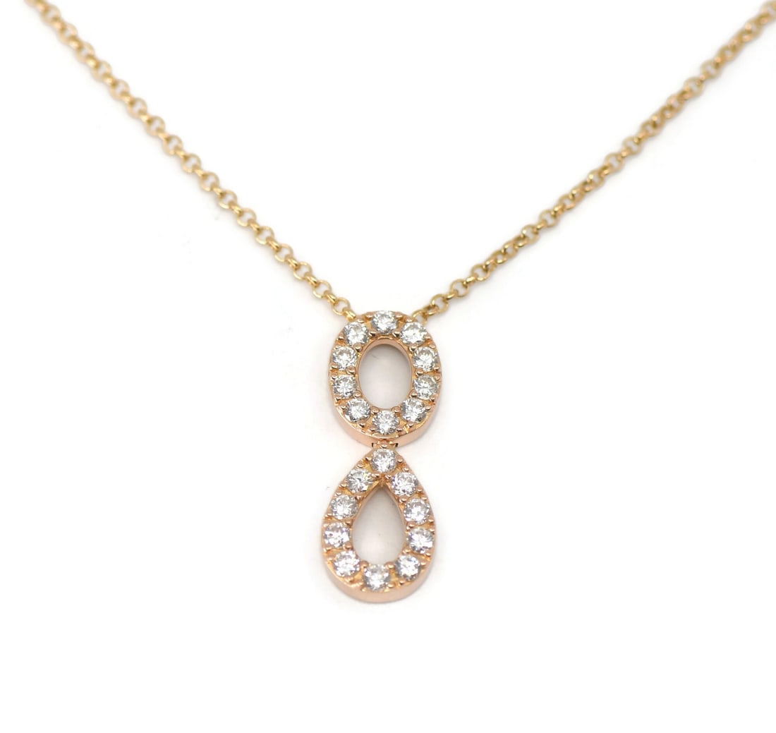 Mouawad Diamond Pendant Necklace in 18K Rose Gold: Mouawad Diamond Pendant Necklace in 18K Rose Gold Elegant Mouawad necklace crafted in 18k rose gold and set with a diamond. This pre-owned piece features a pendant style design and offers a refined lo
