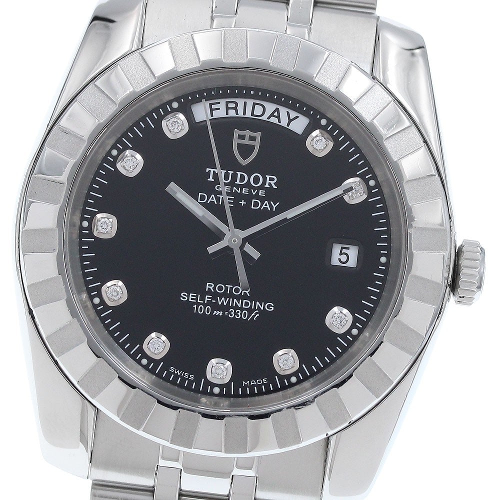 TUDOR Classic Date-Day Ref 23010 Mens Automatic Wristwatch: TUDOR Classic Date-Day Ref 23010 Mens Automatic Wristwatch Tudor Classic Date-Day men's wristwatch with a black dial and automatic movement. This stainless steel watch features a day-date display and 