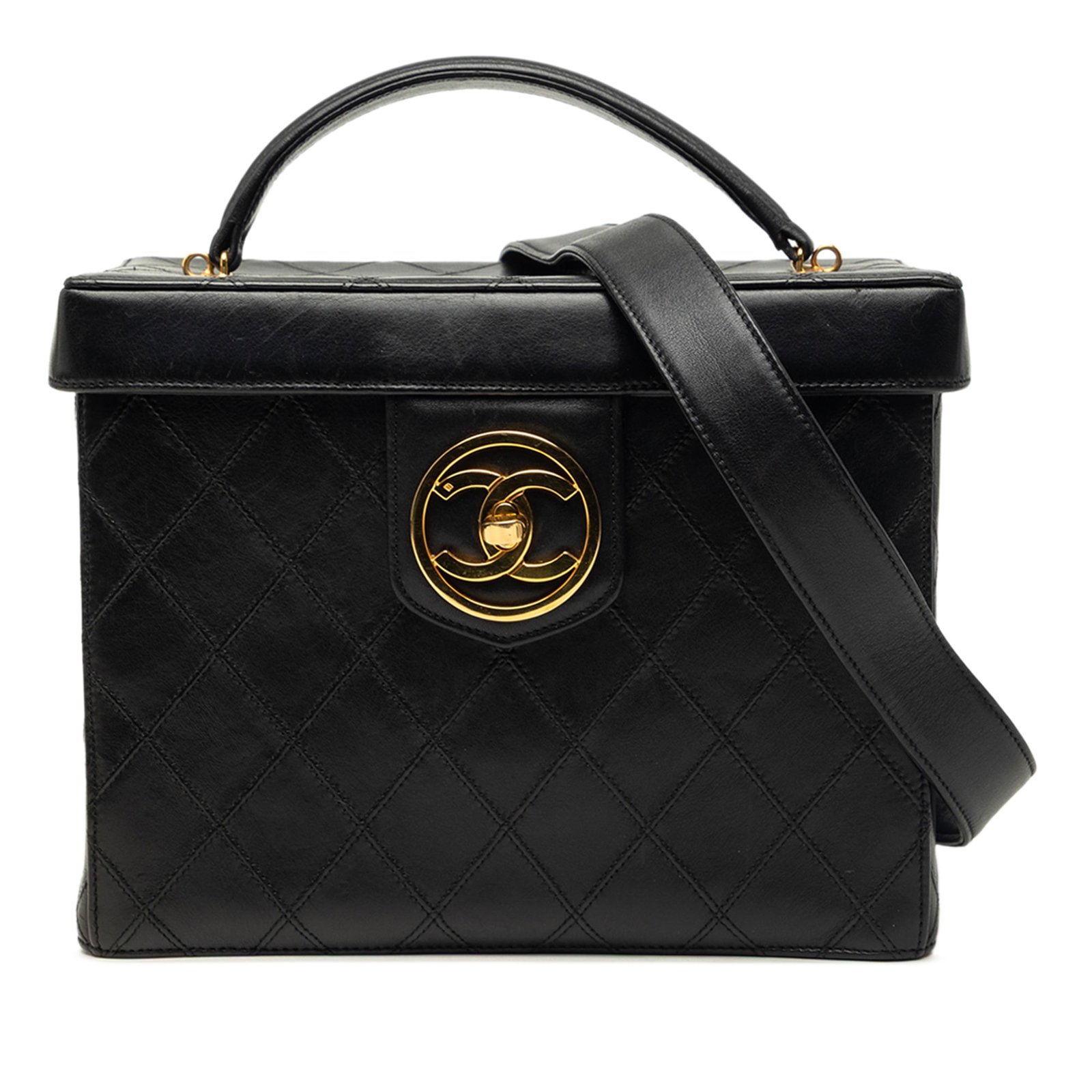 Chanel CC Quilted Lambskin Vanity Bag with Top Handle: Chanel CC Quilted Lambskin Vanity Bag with Top Handle A Chanel CC quilted lambskin top handle vanity case in black, crafted in Italy. This structured bag features a quilted lambskin leather body, a fl