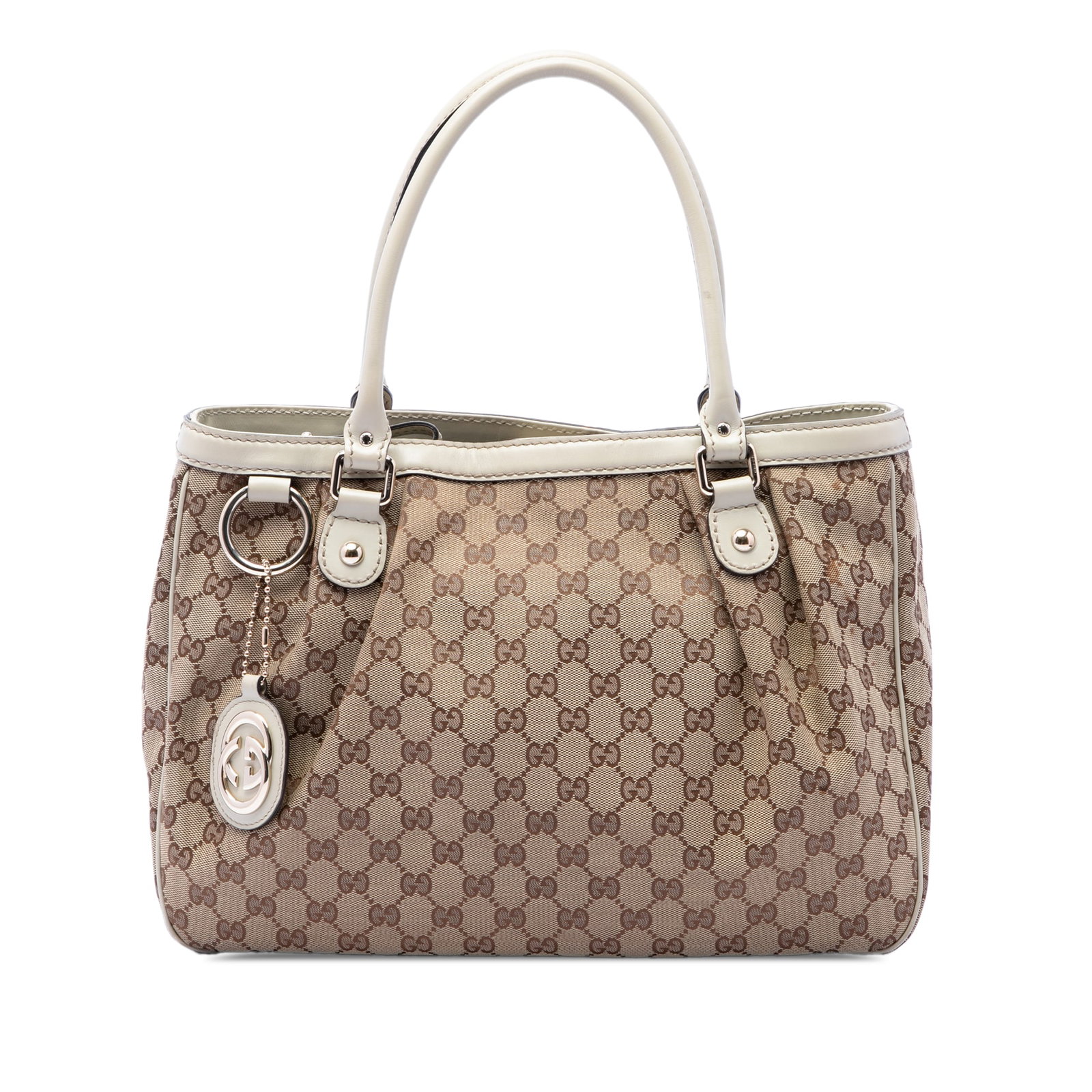 Gucci Sukey Tote Beige GG Canvas and Leather Trim Bag: Gucci Sukey Tote Beige GG Canvas and Leather Trim Bag Gucci GG Canvas Sukey tote bag crafted with a canvas body and leather trim. It features rolled leather handles, an open top with magnetic snap clo
