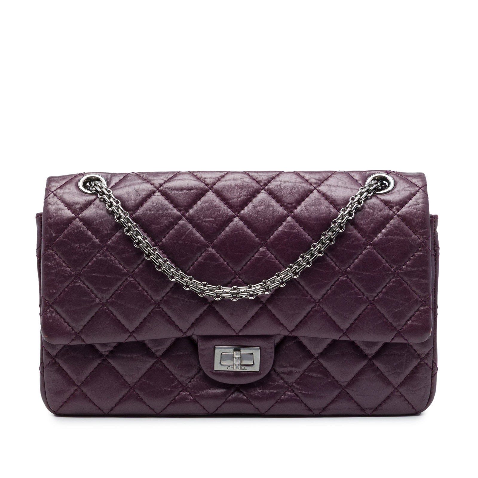 Chanel Reissue 2.55 226 Metallic Quilted Calfskin Shoulder Bag: Chanel Reissue 2.55 226 Metallic Quilted Calfskin Shoulder Bag A Chanel Reissue 2.55 Double Flap 226 shoulder bag in purple quilted metallic aged calfskin. This bag features silver-tone chain straps, 
