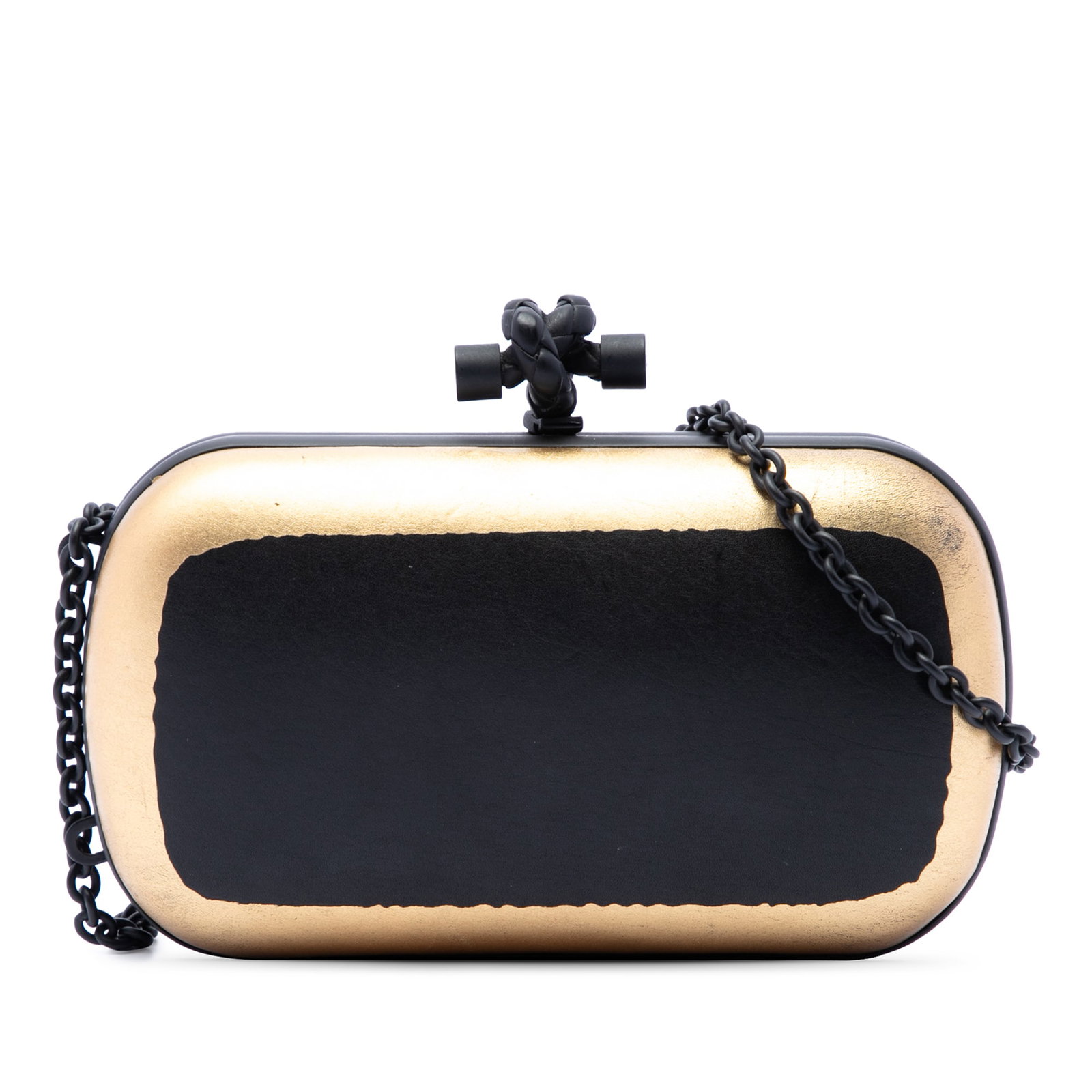 Bottega Veneta Knot Chain Clutch in Bicolor Waxed Leather: Bottega Veneta Knot Chain Clutch in Bicolor Waxed Leather Bottega Veneta crossbody clutch crafted in bicolor gilded waxed leather with a structured top frame and signature knot clasp closure. The bag 