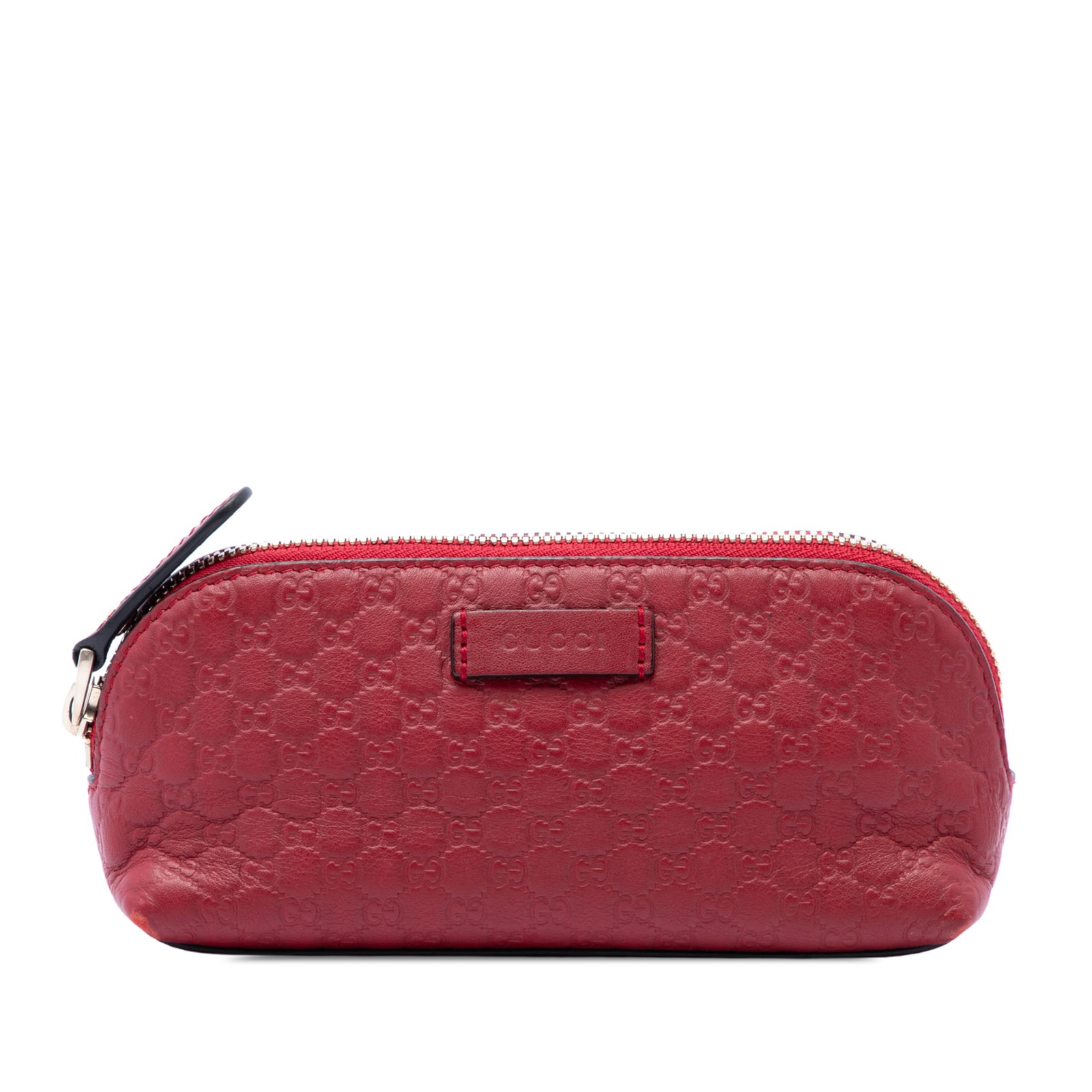 Red Leather Cosmetic Pouch Gucci Microguccissima: Red Leather Cosmetic Pouch Gucci Microguccissima A Gucci Microguccissima cosmetic pouch crafted in embossed calf leather with a top zip closure. The red leather design offers a compact format suitable