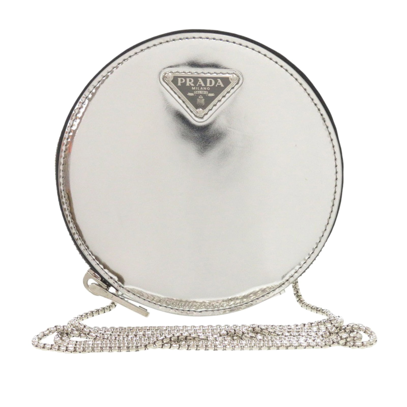 Prada Silver Patent Leather Coin Crossbody Bag: Prada Silver Patent Leather Coin Crossbody Bag This Prada Spazzolato Round Chain Coin Crossbody features a patent leather body in silver, complemented by a chain strap and a top zip closure. The compa