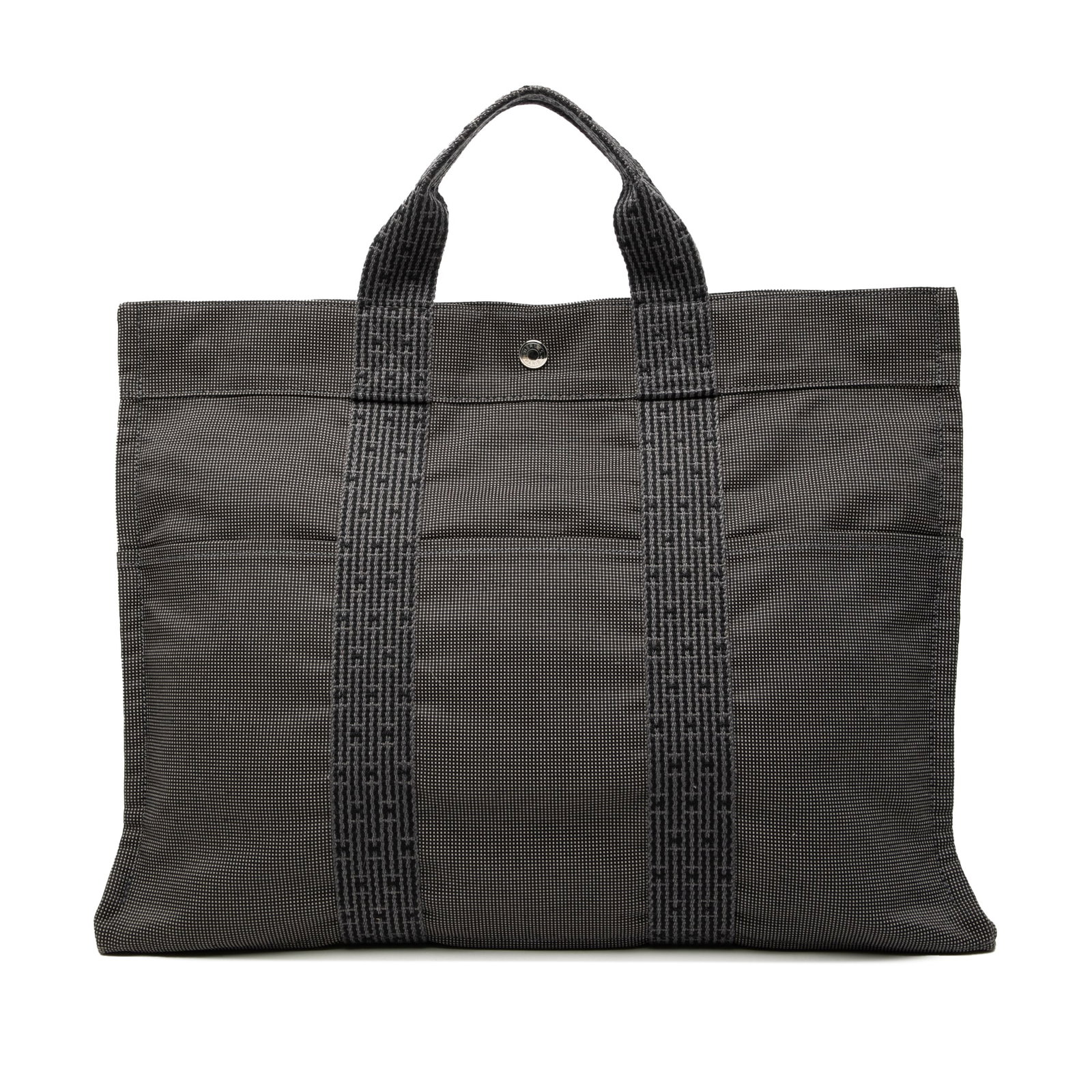 Herline MM Gray Tote Bag by Hermes in Canvas Fabric: Herline MM Gray Tote Bag by Hermes in Canvas Fabric The Hermes Herline MM tote features a gray canvas body with flat handles, exterior front and back slip pockets, a top zip closure, and an interior s