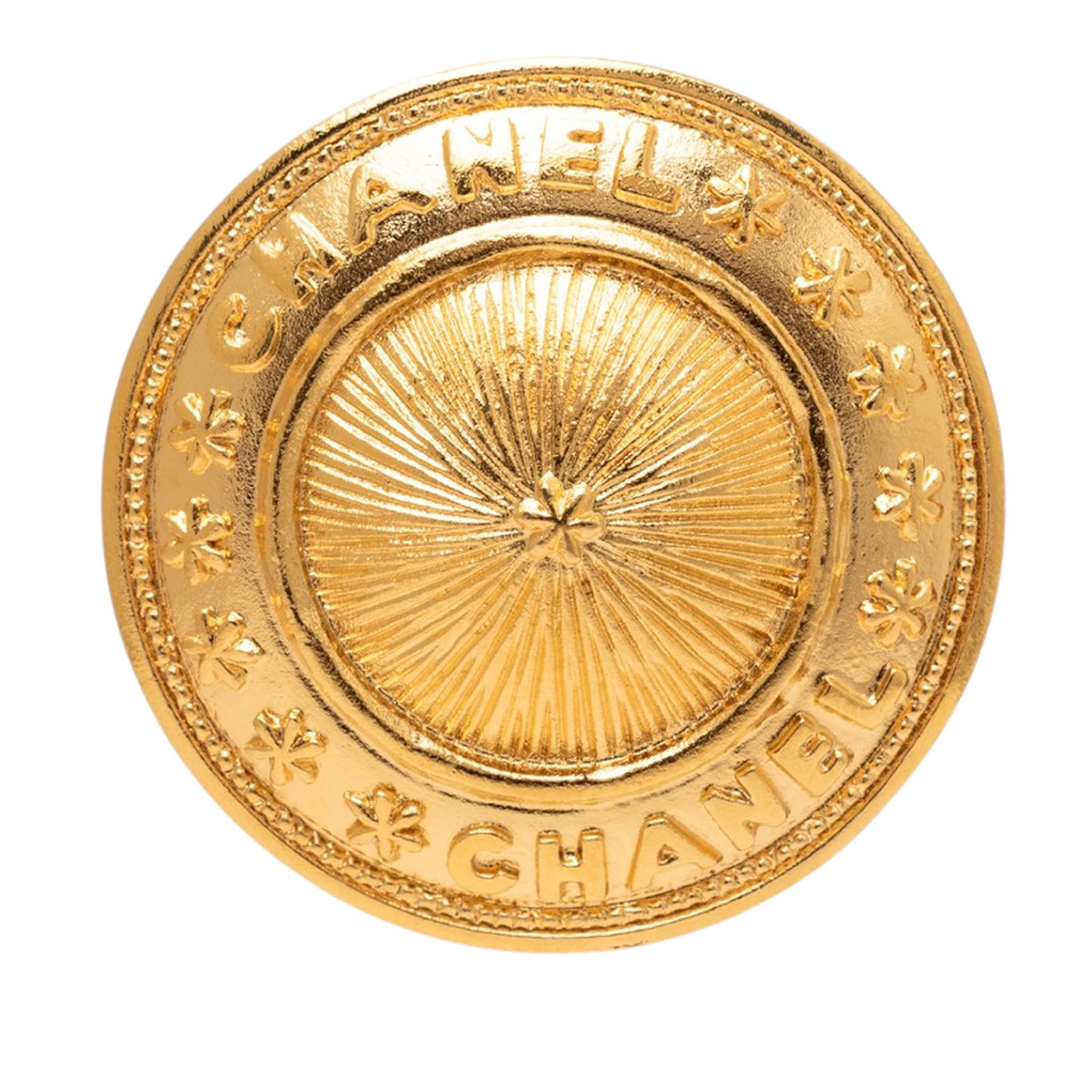 Chanel CC Sunburst Medallion Gold Plated Brooch: Chanel CC Sunburst Medallion Gold Plated Brooch Gold-plated metal brooch with a sunburst medallion design and back pin closure. Made in France, this costume piece is finished in gold and measures 3.80