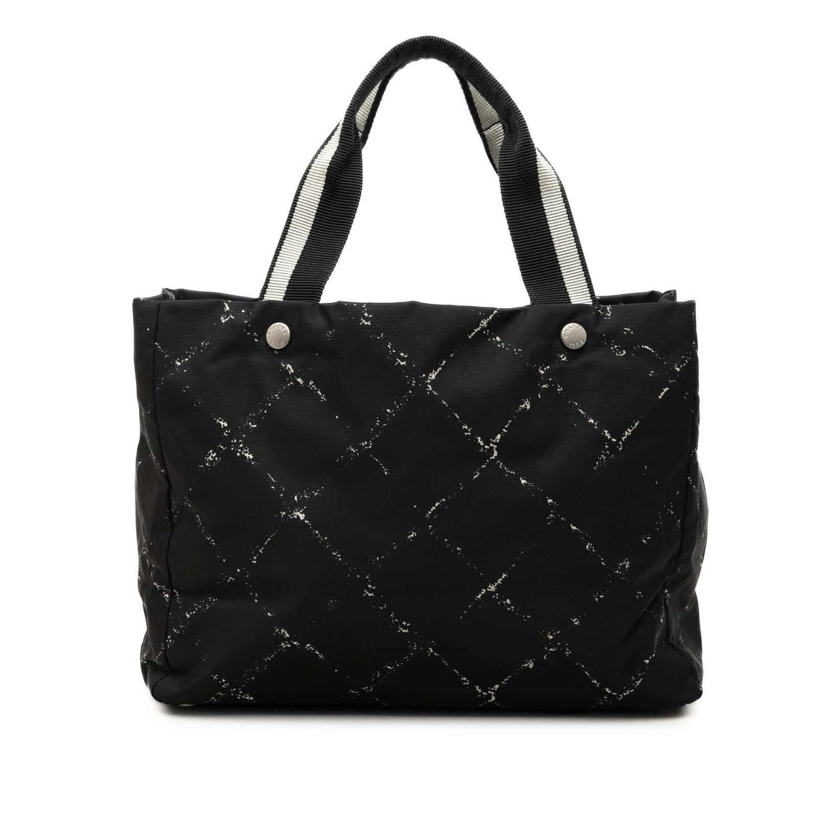 Chanel Old Travel Line Black Nylon Tote Bag: Chanel Old Travel Line Black Nylon Tote Bag This Chanel Old Travel Line tote is crafted with a nylon body and flat shoulder straps. The open-top design offers easy access, while interior zip pockets p