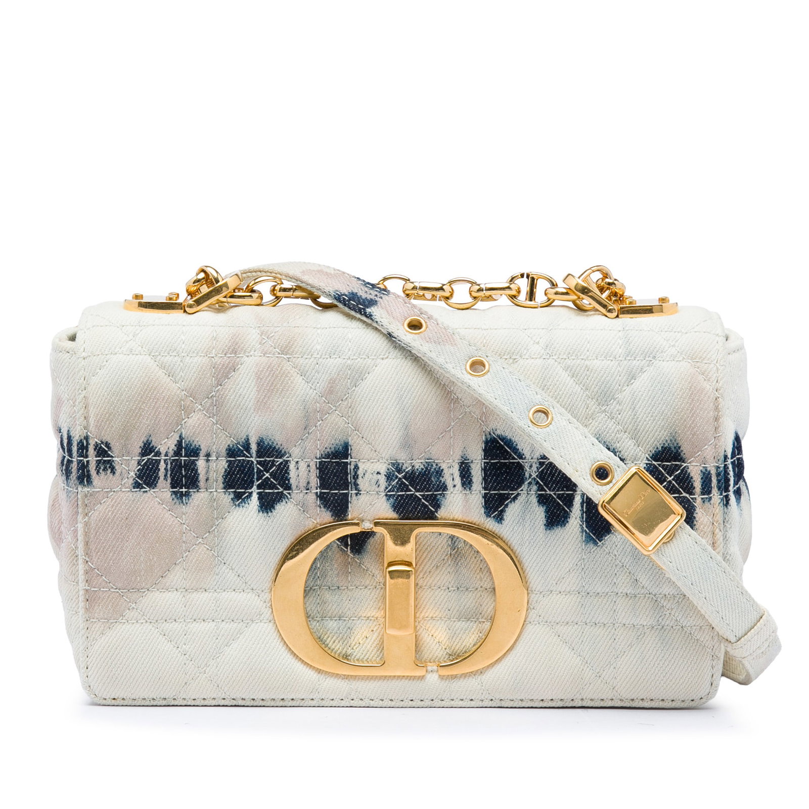 Dior Caro Small Tie Dye Denim Crossbody Bag: Dior Caro Small Tie Dye Denim Crossbody Bag A Dior Caro crossbody bag crafted in tie dye denim with a flap front and turn lock closure. The design includes a flat denim and chain shoulder strap, an ex