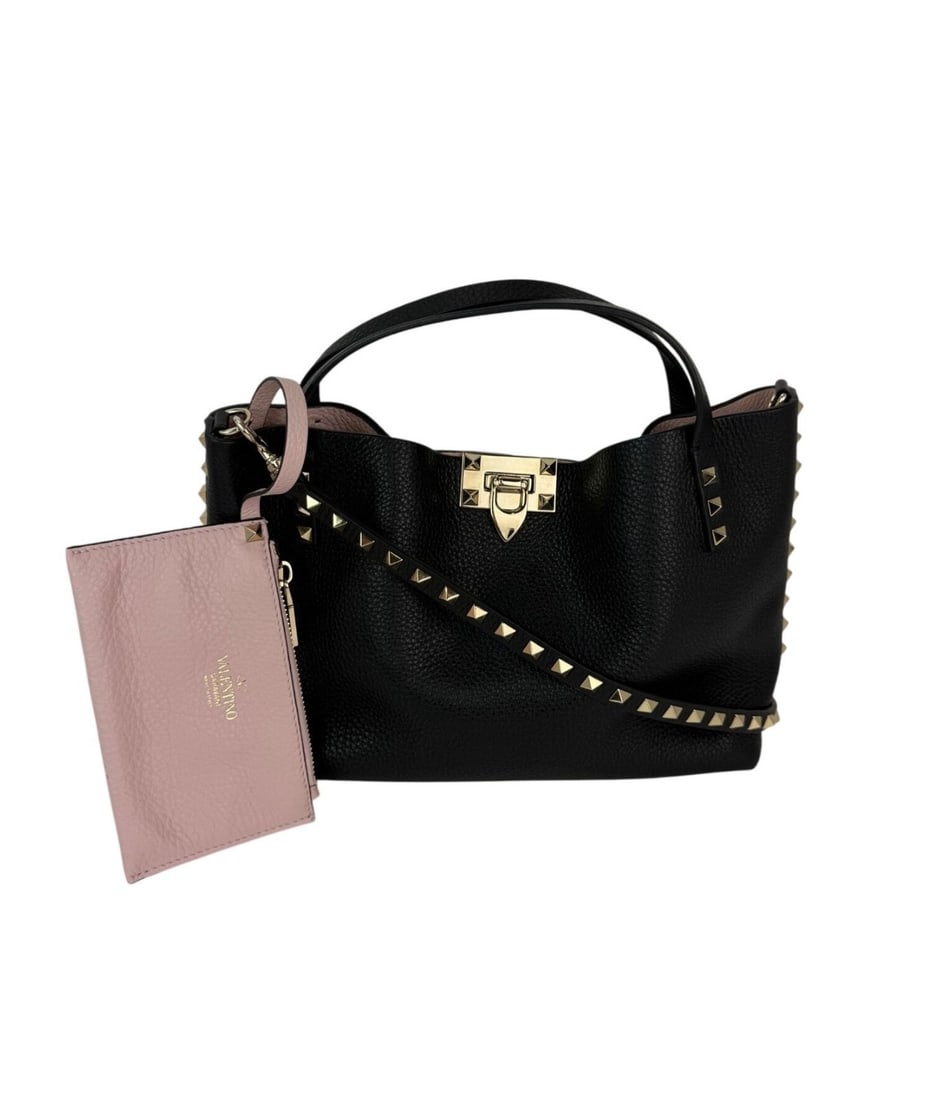 Valentino Garavani Rockstud Small Black Leather Tote with Strap: Valentino Garavani Rockstud Small Black Leather Tote with Strap Discover the elegance of the Valentino Giaravani Rockstud Small Tote Bag, a chic accessory that combines style and functionality. This b