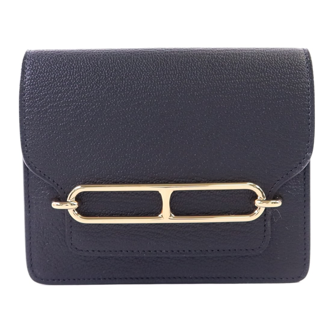 Hermes Roulis Slim bi fold wallet in Noir Chevre leather: Hermes Roulis Slim bi fold wallet in Noir Chevre leather Hermes Roulis Slim bi-fold wallet in Noir Chevre goatskin leather with black and gold-tone detailing. This unisex wallet features a slim bi-fol