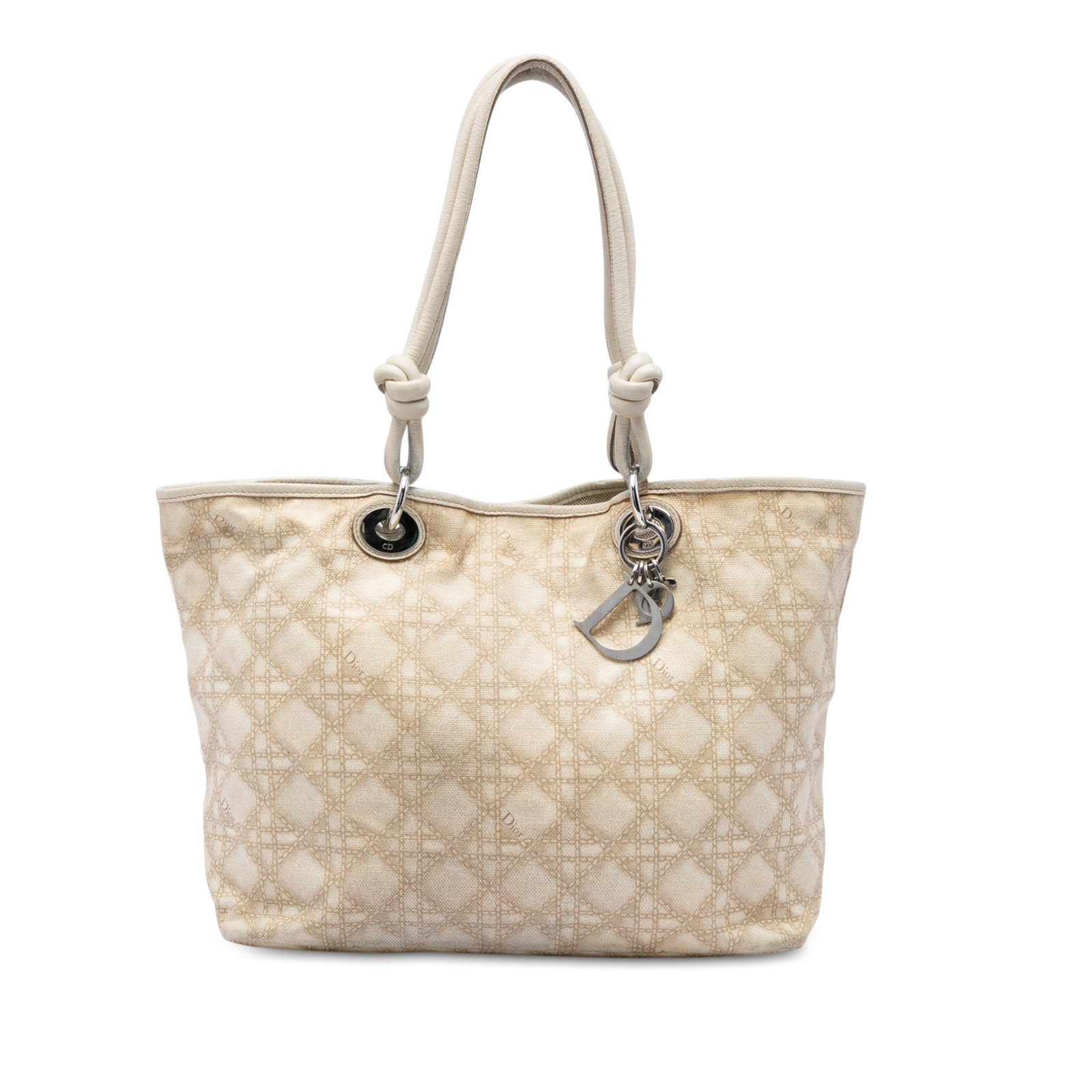 Dior Cherie Shopper Tote in Beige Cannage Canvas: Dior Cherie Shopper Tote in Beige Cannage Canvas A Dior Cherie shopper tote crafted in canvas with the house's Cannage print. This large tote features knotted leather handles, an open top with magneti