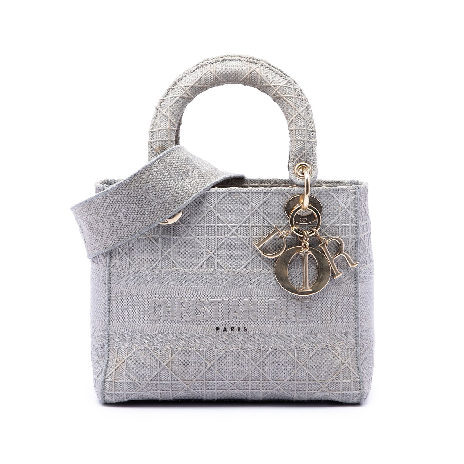 Dior Lady D Lite Medium Cannage Canvas Handbag Gray: Dior Lady D Lite Medium Cannage Canvas Handbag Gray A Dior Lady D-Lite medium bag crafted in gray canvas with the Cannage pattern. It features flat top handles, a detachable strap, a fold-in flap clos