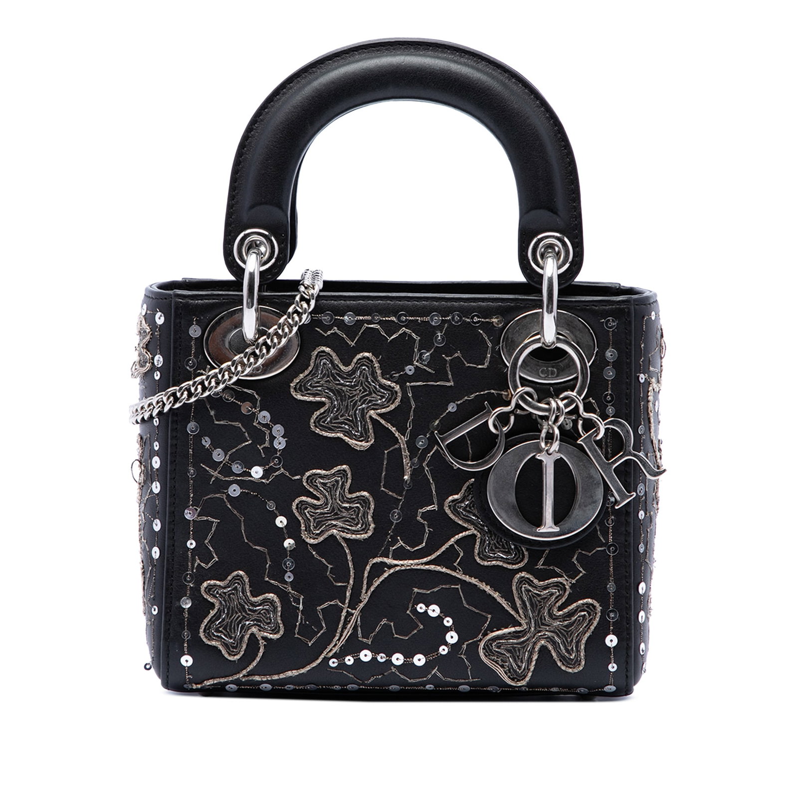 Dior Lady Dior Mini Bag in Black Calfskin with Clover Embroidery: Dior Lady Dior Mini Bag in Black Calfskin with Clover Embroidery A compact Lady Dior handbag crafted in black calfskin with embroidered clover detailing. This mini bag features flat leather top handle