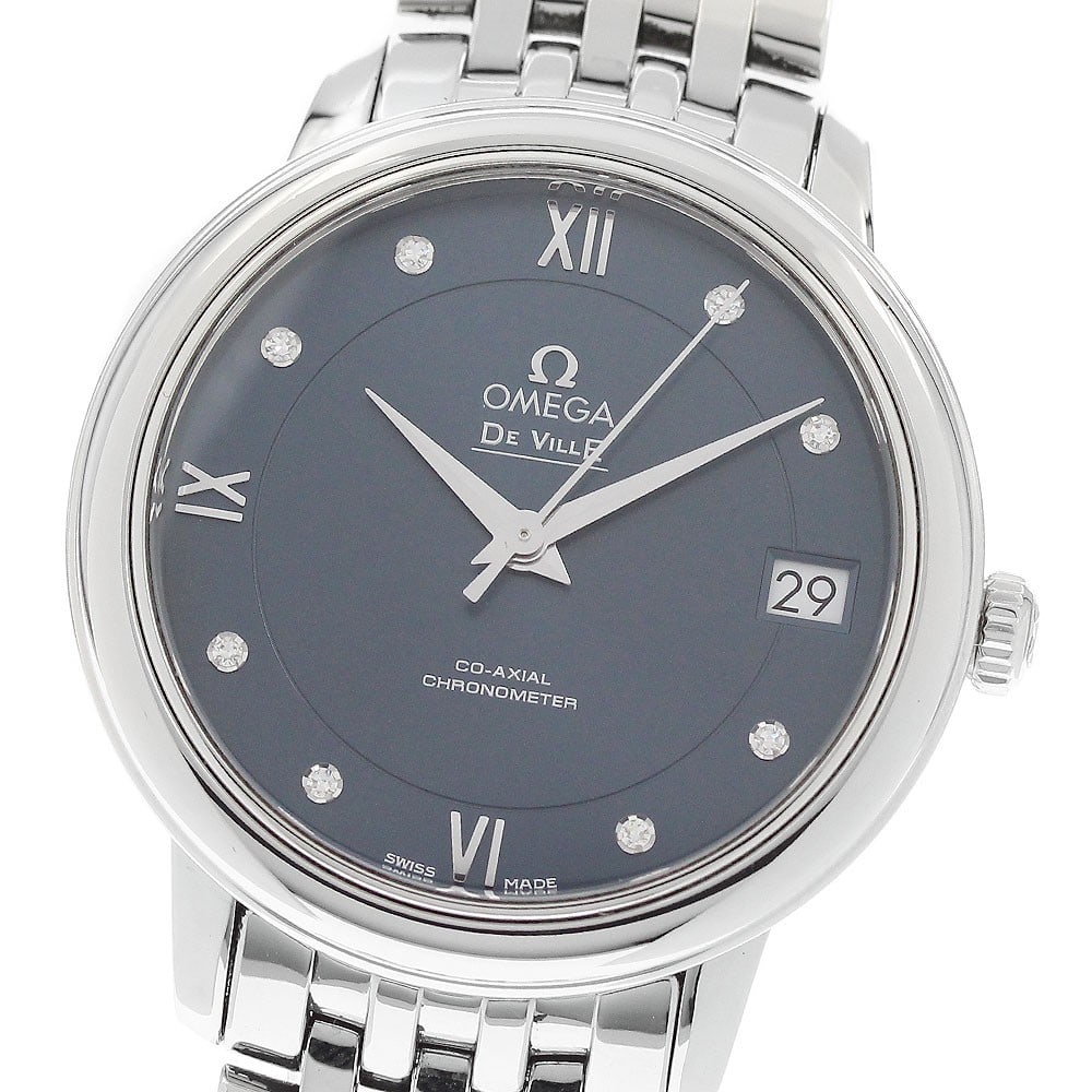 OMEGA De Ville Prestige ladies wristwatch ref 424.10.33.20.53.001 date: OMEGA De Ville Prestige ladies wristwatch ref 424.10.33.20.53.001 date OMEGA De Ville Prestige women's wristwatch with an automatic movement, navy dial, and date display. This watch-only offering feat