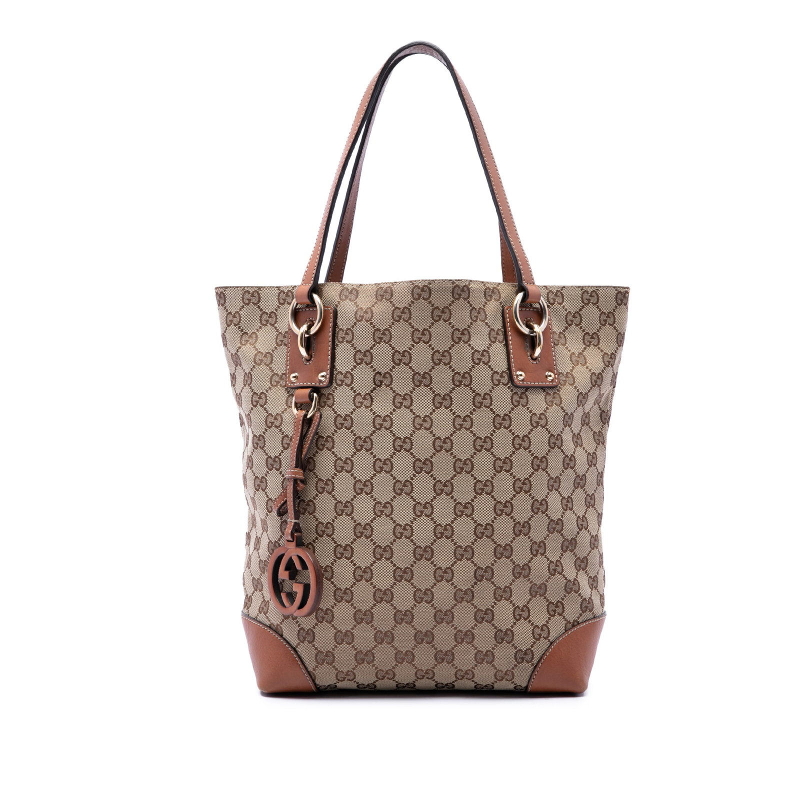 Gucci GG Charm Tote Beige Canvas Handbag with Leather Trim: Gucci GG Charm Tote Beige Canvas Handbag with Leather Trim Gucci GG Canvas GG Charm Tote in beige with a canvas body, leather trim, and signature GG charm detail. This tote features flat leather handl