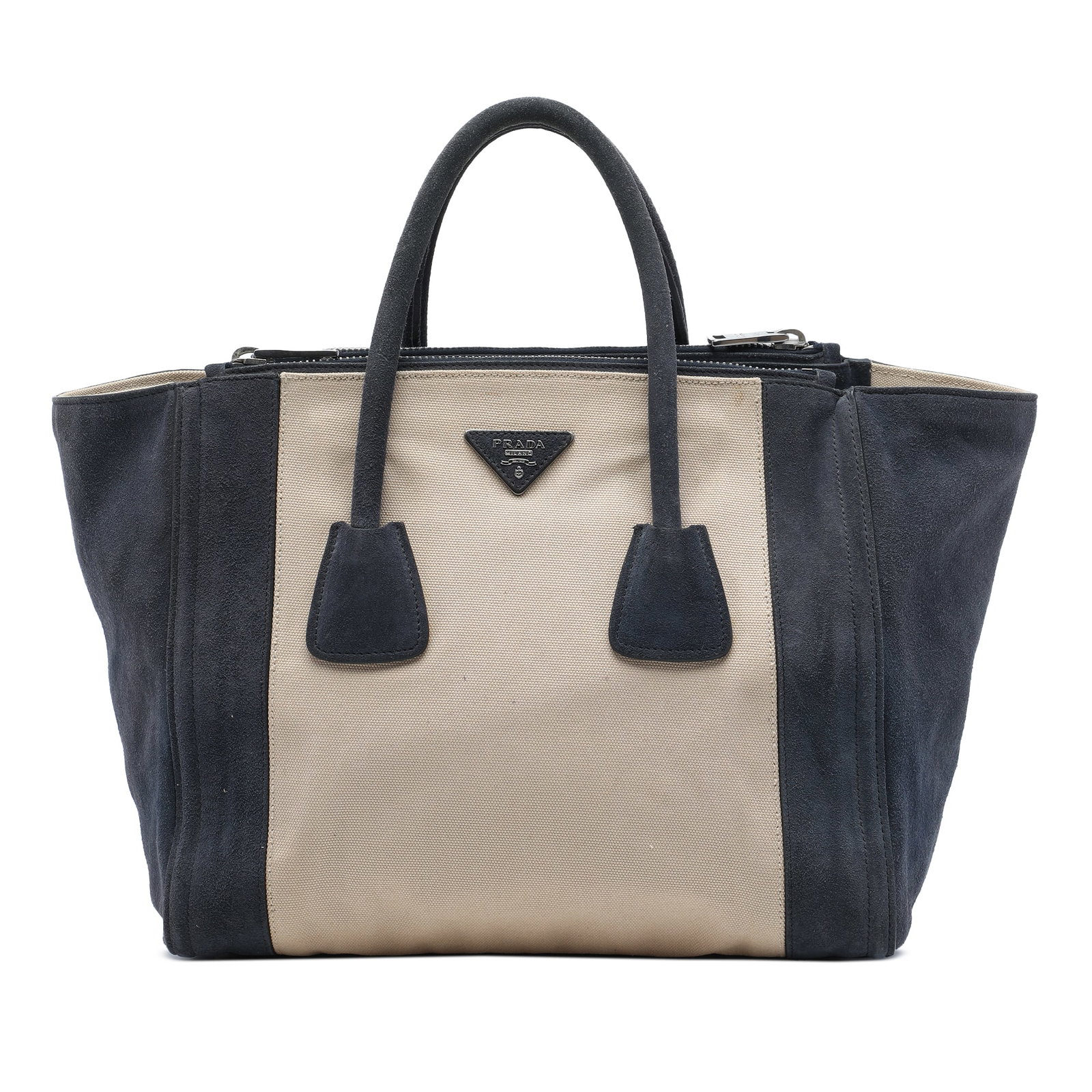 Prada Twin Pocket Double Handle Satchel in Canvas and Suede: Prada Twin Pocket Double Handle Satchel in Canvas and Suede Prada satchel crafted with a canvas and suede body in beige. The design features rolled double handles, an open top with magnetic closure, d