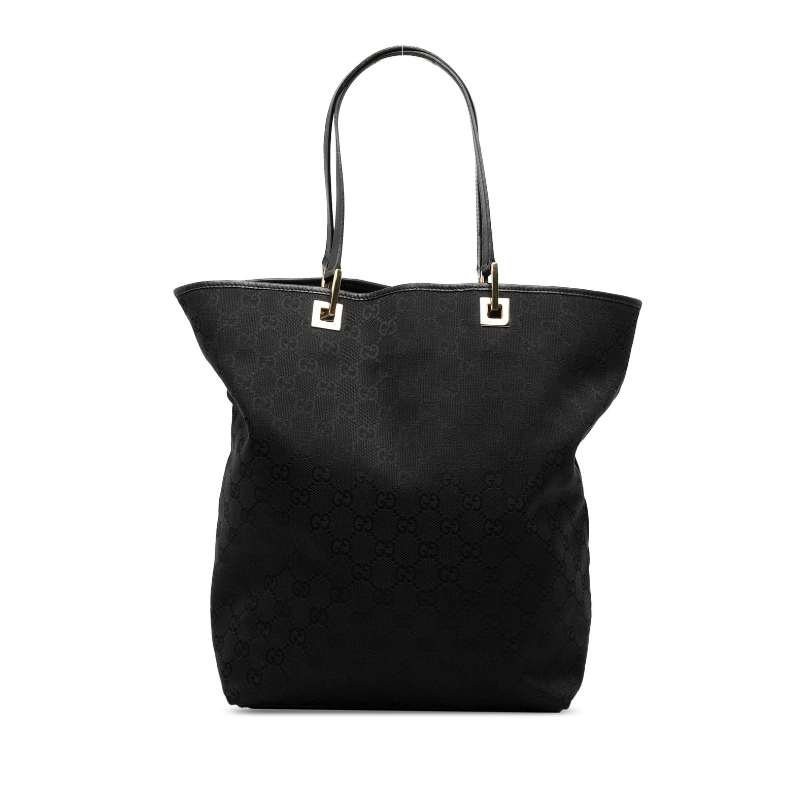 Black GG Canvas Tote Bag with Leather Trim by Gucci: Black GG Canvas Tote Bag with Leather Trim by Gucci This Gucci GG Canvas Tote features a canvas body with leather trim, flat leather straps, an open top, and an interior zip pocket. The bag is crafted