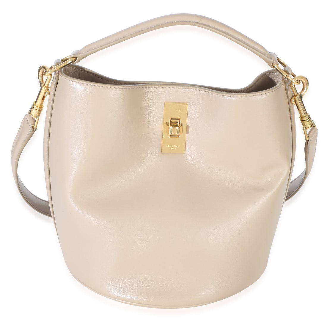 Celine Teen Bucket 16 Bag Beige Leather Turnlock: Celine Teen Bucket 16 Bag Beige Leather Turnlock Pre-owned Celine Teen Bucket 16 Bag in tan smooth calfskin with a bucket silhouette and turnlock closure. This unisex bag features a suede lining and g