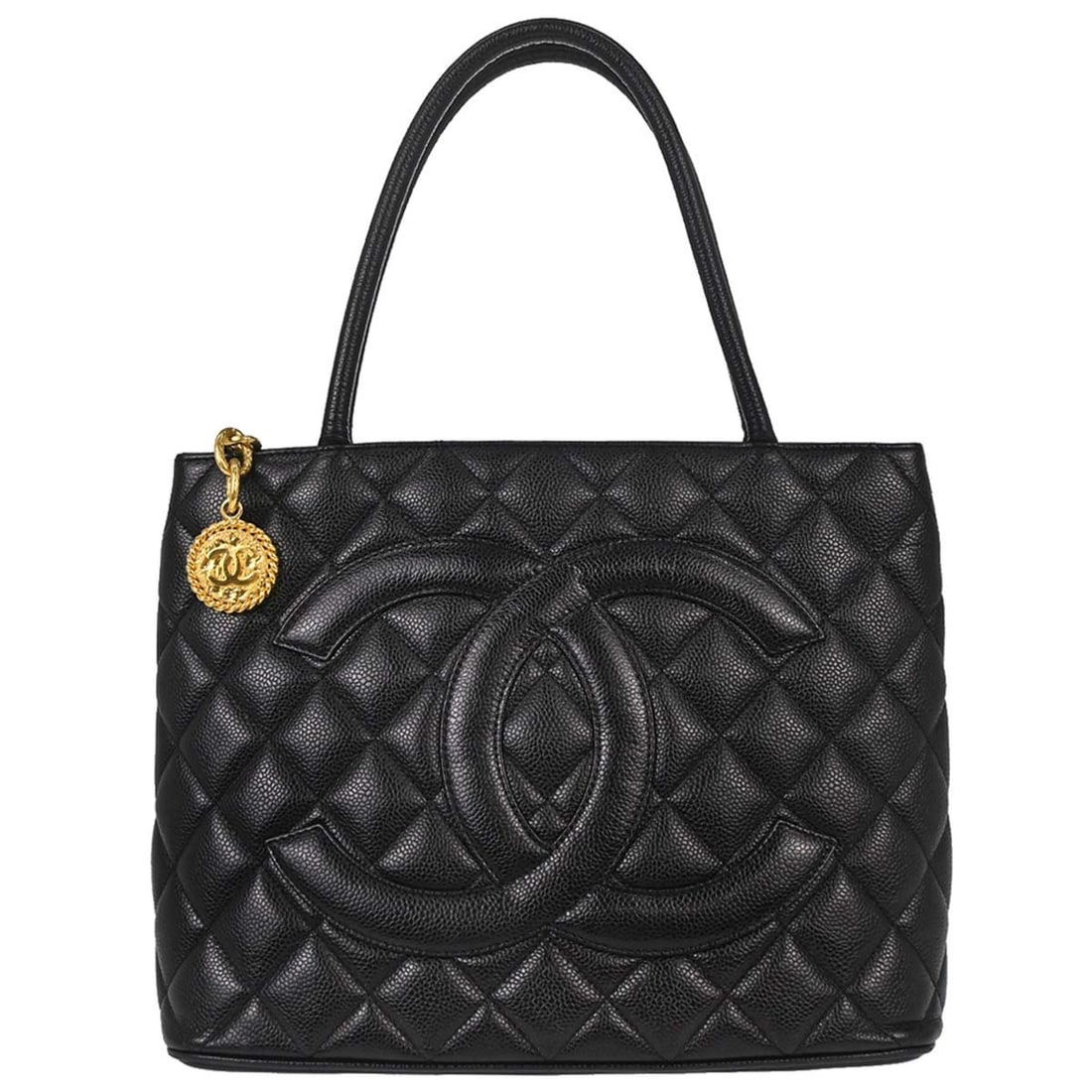 CHANEL Medallion Tote in Black Caviar Skin Leather: CHANEL Medallion Tote in Black Caviar Skin Leather Chanel Medallion tote handbag in black caviar skin leather with matelasse quilting, double handles, and a zip-top closure. The bag features an exteri