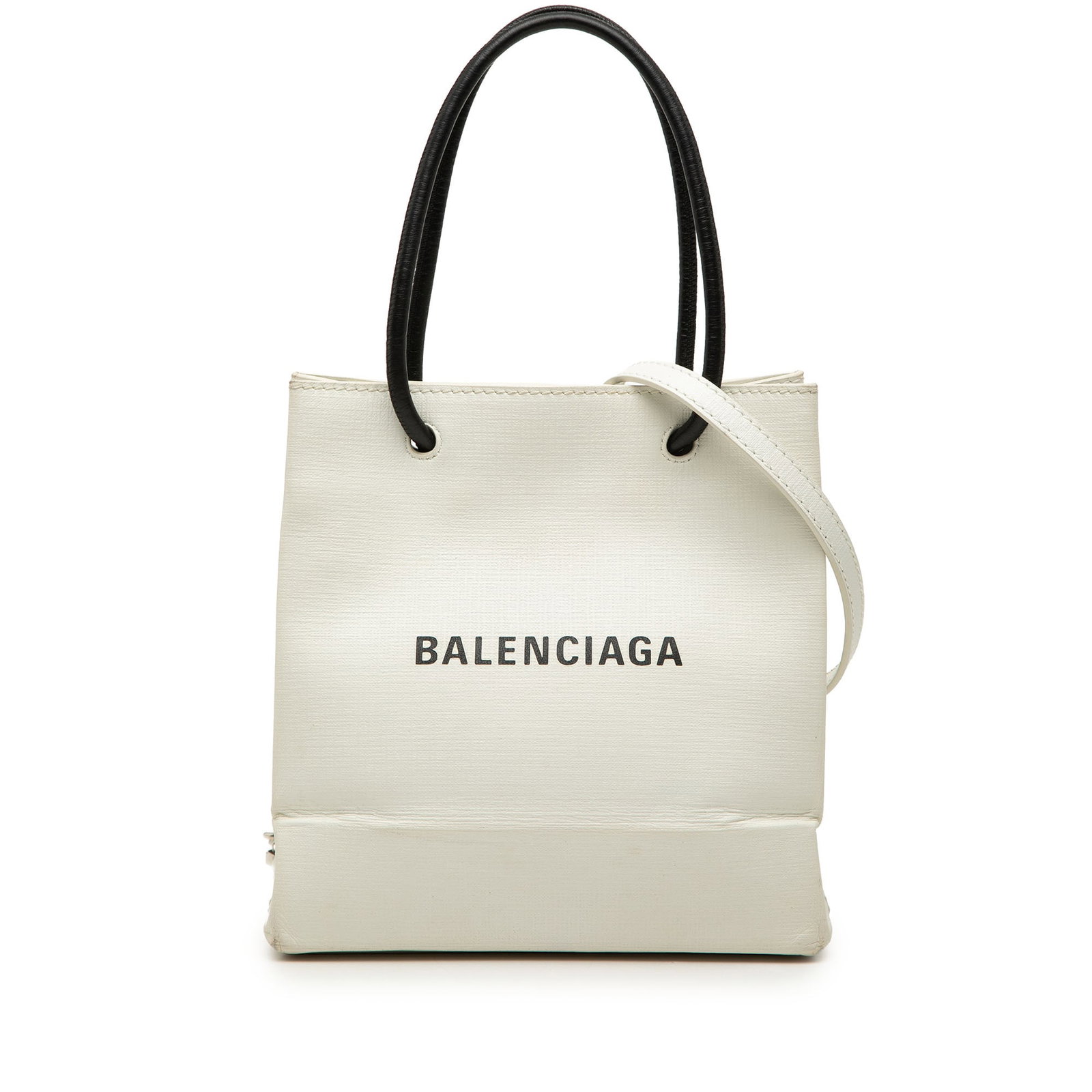 Balenciaga XXS Logo Shopping Tote White Leather Shoulder Bag: Balenciaga XXS Logo Shopping Tote White Leather Shoulder Bag Balenciaga Leather Logo Shopping Tote XXS in white leather with rolled top handles and a detachable flat strap. The bag features an open to