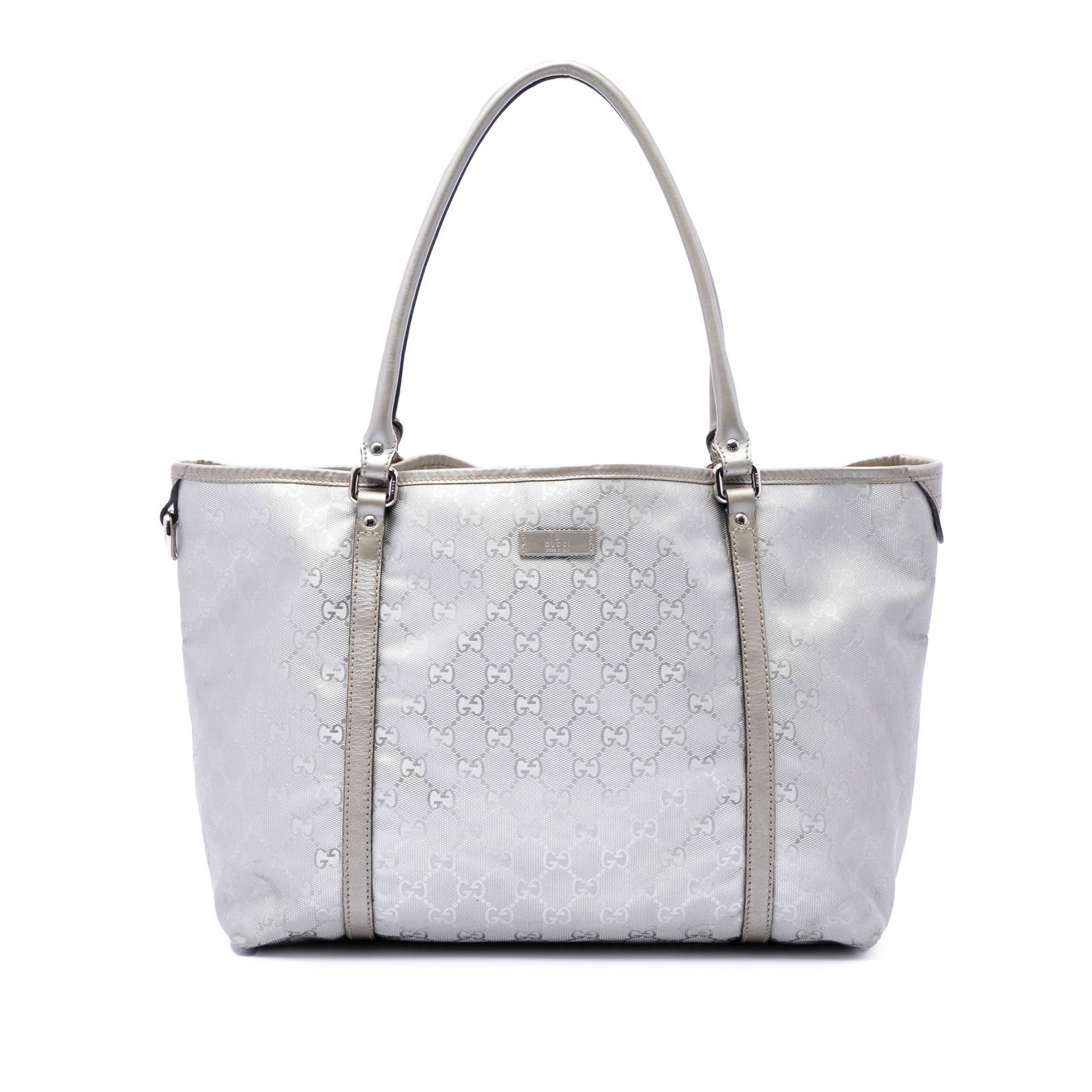 Gucci Joy Tote Medium GG Imprime Silver PVC Handbag: Gucci Joy Tote Medium GG Imprime Silver PVC Handbag Gucci Medium GG Imprime Joy Tote in silver with a PVC body, leather trim, and rolled leather handles. The tote features an open top with magnetic sn
