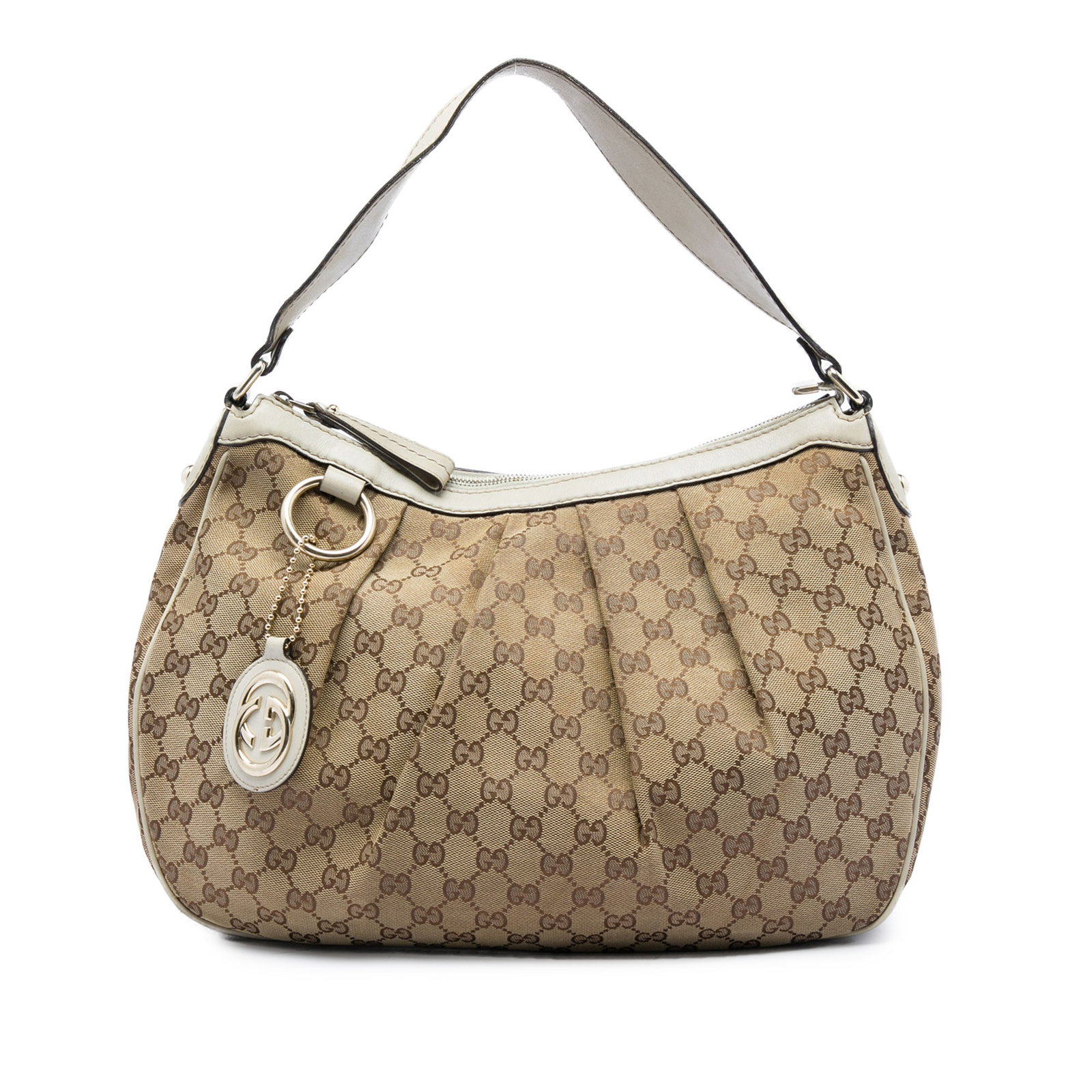 Gucci Sukey GG Canvas Shoulder Bag with Leather Trim: Gucci Sukey GG Canvas Shoulder Bag with Leather Trim Gucci Sukey shoulder bag in beige GG canvas with leather trim. This shoulder bag features a flat leather strap, top zip closure, and an interior wi