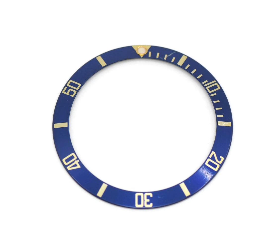 Rolex 16613 Submariner bezel insert: Rolex 16613 Submariner bezel insert Pre-owned Rolex Submariner insert, reference 16613. This authentic replacement part is made in Switzerland and is compatible with Rolex Submariner models. Specifica