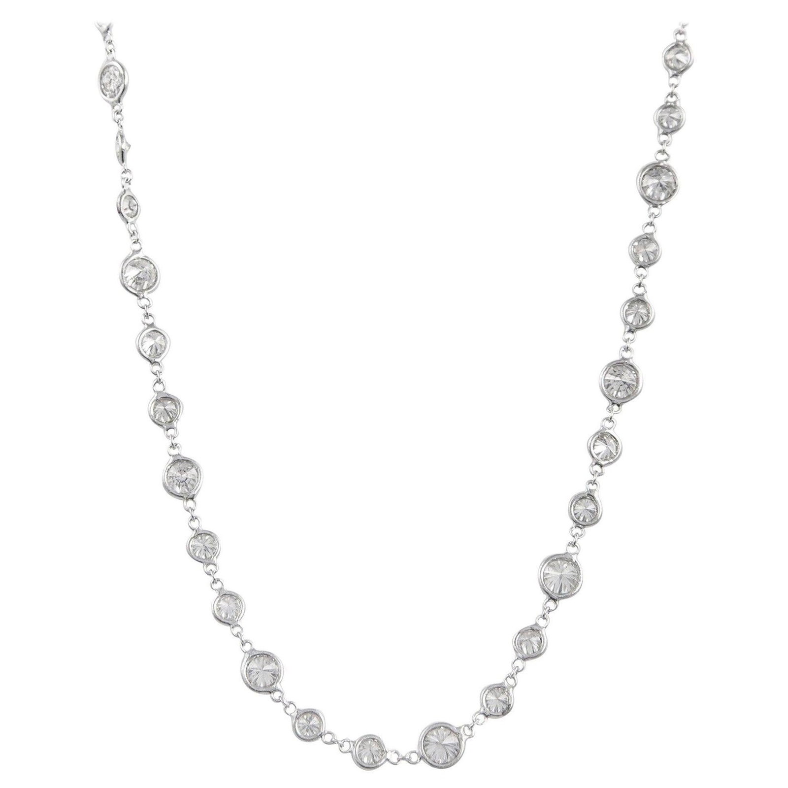 18k White Gold Diamond Necklace 9.69ct Diamonds by the Yard: 18k White Gold Diamond Necklace 9.69ct Diamonds by the Yard Contemporary Diamonds by the Yard necklace featuring 68 natural round brilliant diamonds with an approximate total weight of 9.69 ct, bezel 