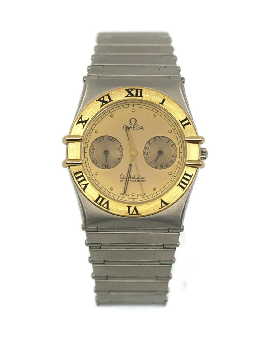 Omega Constellation Day Date Two Tone Stainless Steel Quartz Watch: Omega Constellation Day Date Two Tone Stainless Steel Quartz Watch This Omega Constellation Day Date wristwatch combines elegance and functionality with its sophisticated two-tone stainless steel desi