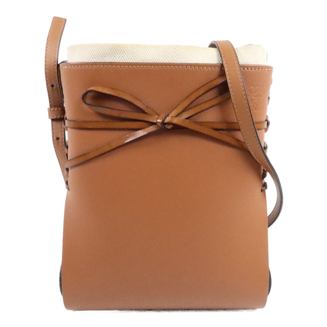 LOEWE Ikebana A858ID1X01 Brown Calfskin Shoulder Bag: LOEWE Ikebana A858ID1X01 Brown Calfskin Shoulder Bag LOEWE Ikebana shoulder bag in brown calfskin leather. This women's shoulder bag features a brown exterior, an adjustable shoulder strap, and one op