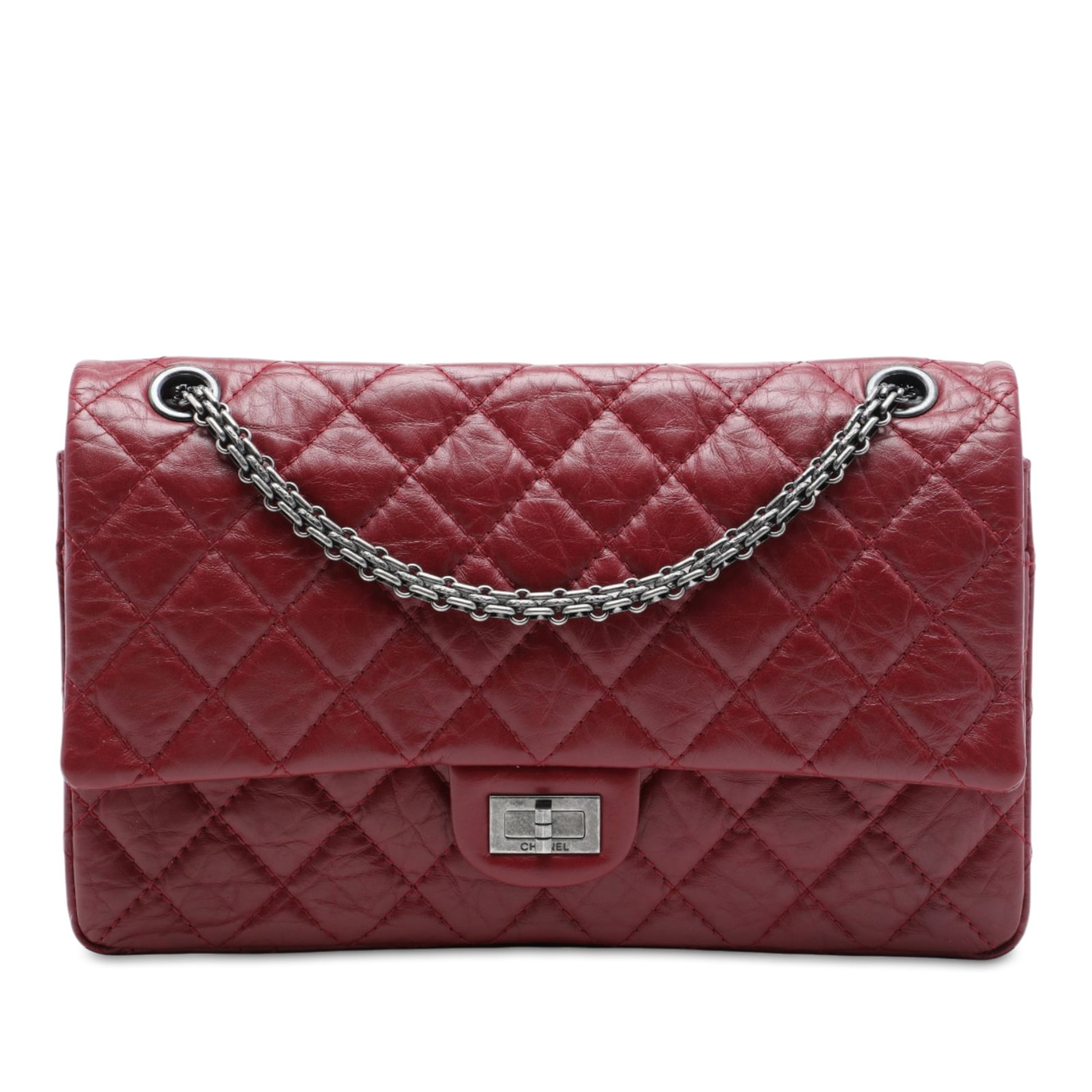 Chanel Reissue 2.55 226 Red Quilted Calfskin Shoulder Bag: Chanel Reissue 2.55 226 Red Quilted Calfskin Shoulder Bag A Chanel Reissue 2.55 Double Flap 226 shoulder bag in red quilted aged calfskin. This bag features silver-tone chain link shoulder straps, dou