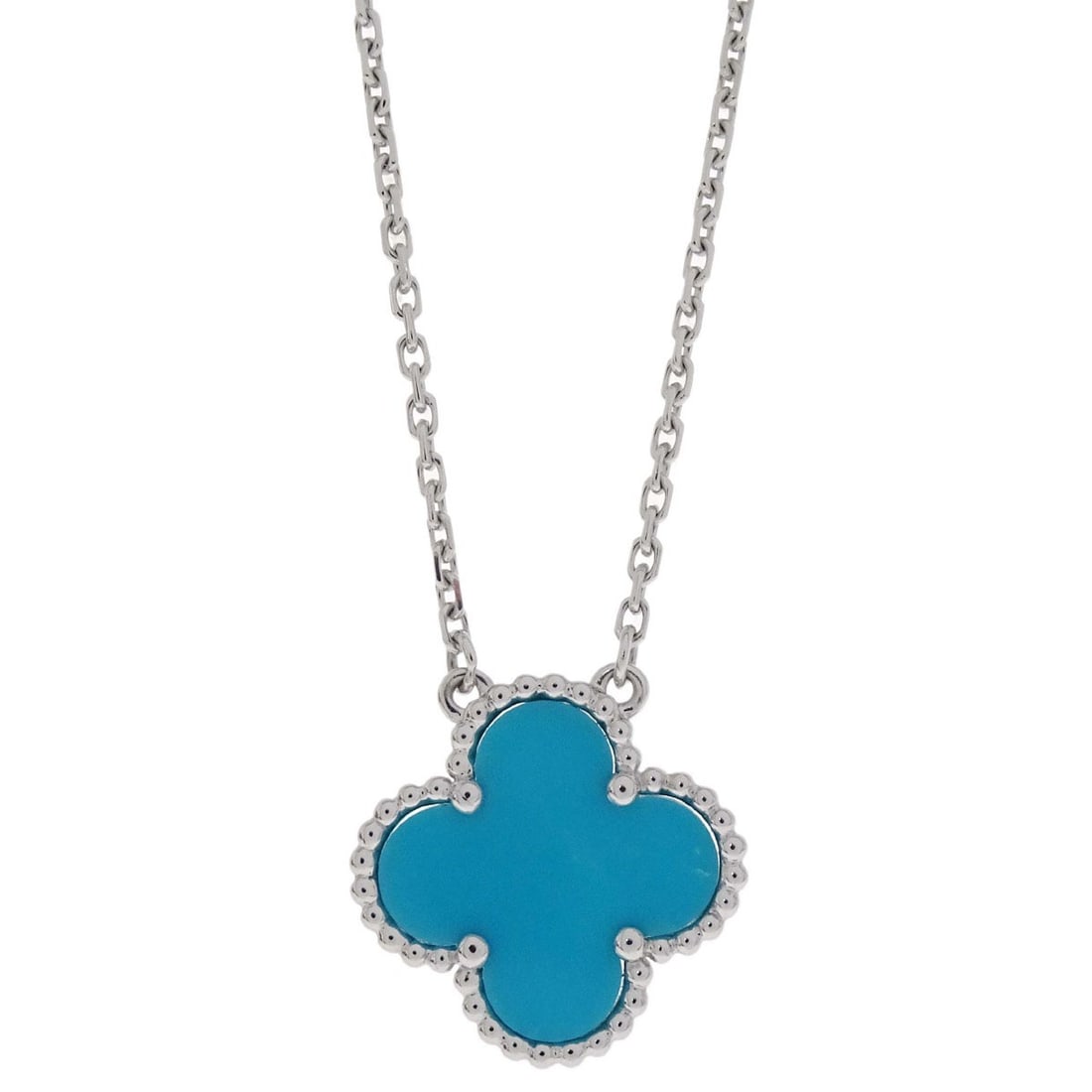 Van Cleef Arpels Vintage Alhambra turquoise white gold necklace: Van Cleef Arpels Vintage Alhambra turquoise white gold necklace Van Cleef & Arpels Vintage Alhambra pendant necklace crafted in Au750 white gold with a turquoise pendant. This charm-style necklace fea