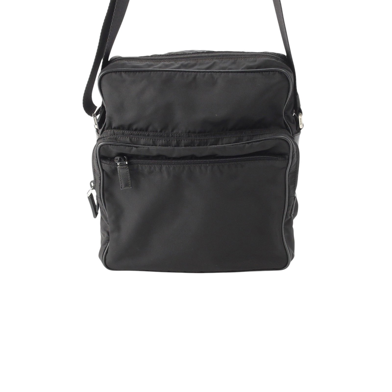 Prada Tessuto nylon crossbody bag with Saffiano trim black: Prada Tessuto nylon crossbody bag with Saffiano trim black Prada crossbody bag crafted with a nylon body and Saffiano leather trim. It features an adjustable flat strap, a zip-top closure, exterior zi
