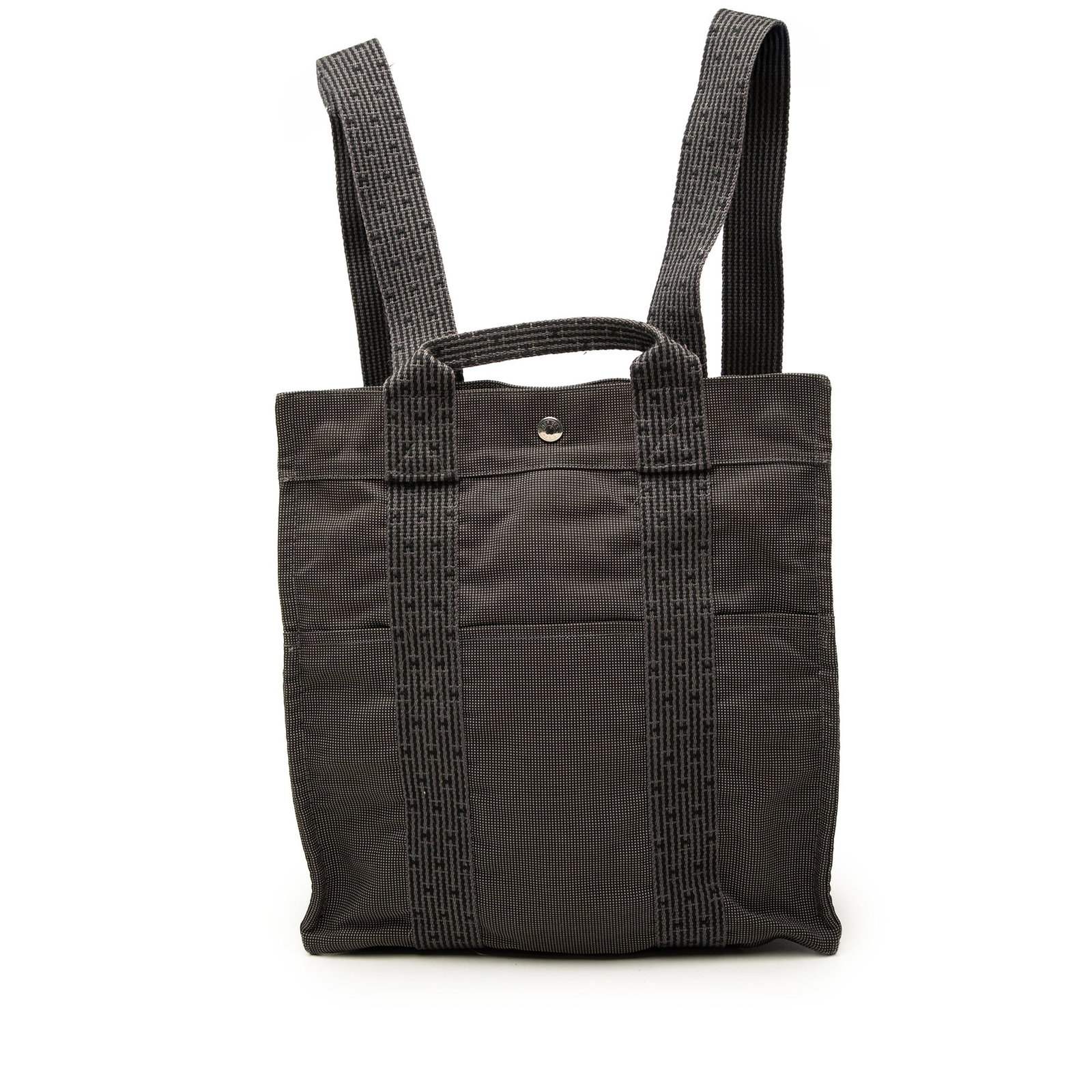 Hermes Herline MM Canvas Backpack Gray: Hermes Herline MM Canvas Backpack Gray Hermes Herline MM backpack in gray canvas with a structured, everyday design. It features a flat top handle, adjustable back straps, an open top with snap button