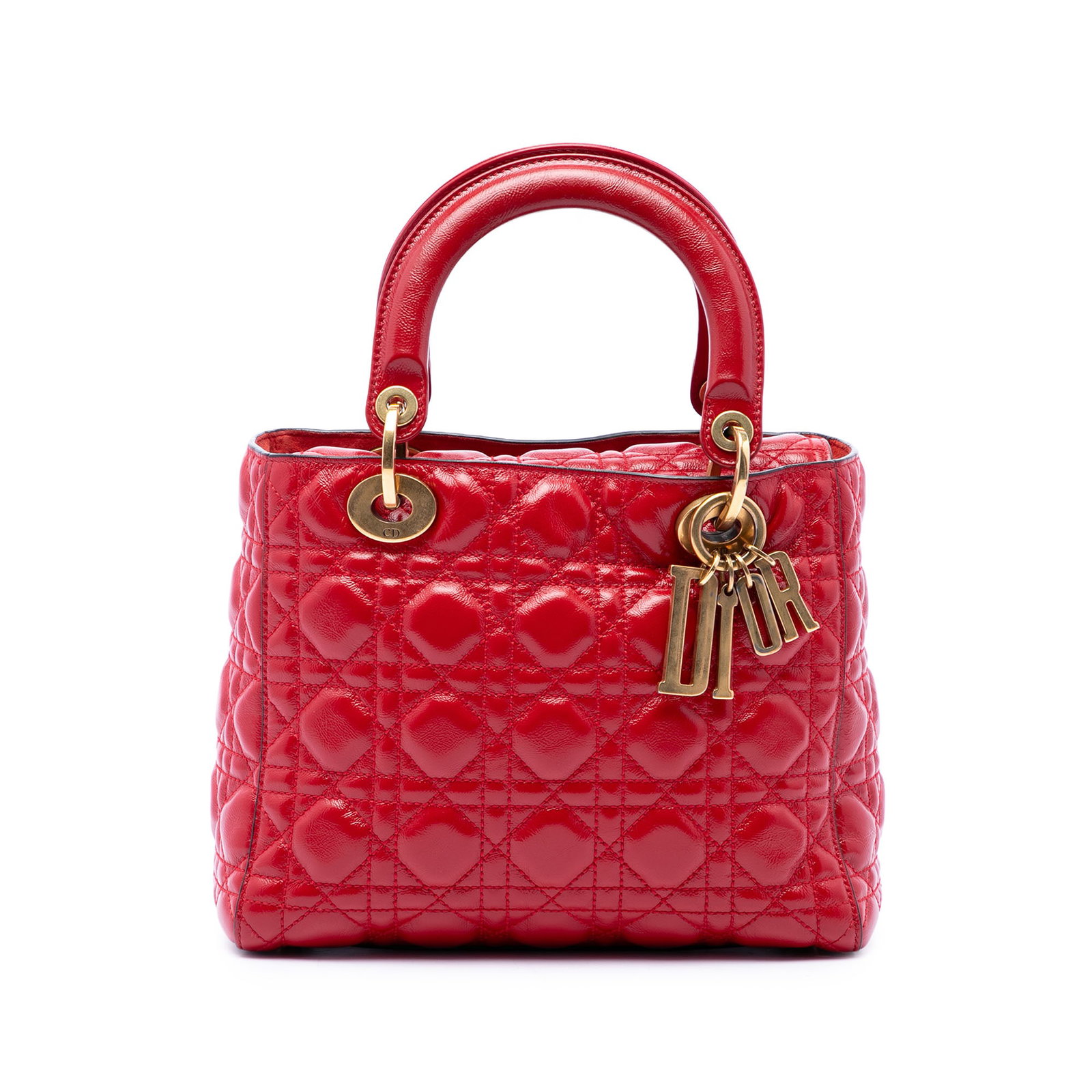 Dior Supple Lady Dior Medium Red Patent Leather Handbag: Dior Supple Lady Dior Medium Red Patent Leather Handbag A medium Lady Dior bag crafted in crinkled patent leather with the signature Cannage quilted design. This supple handbag features flat leather t