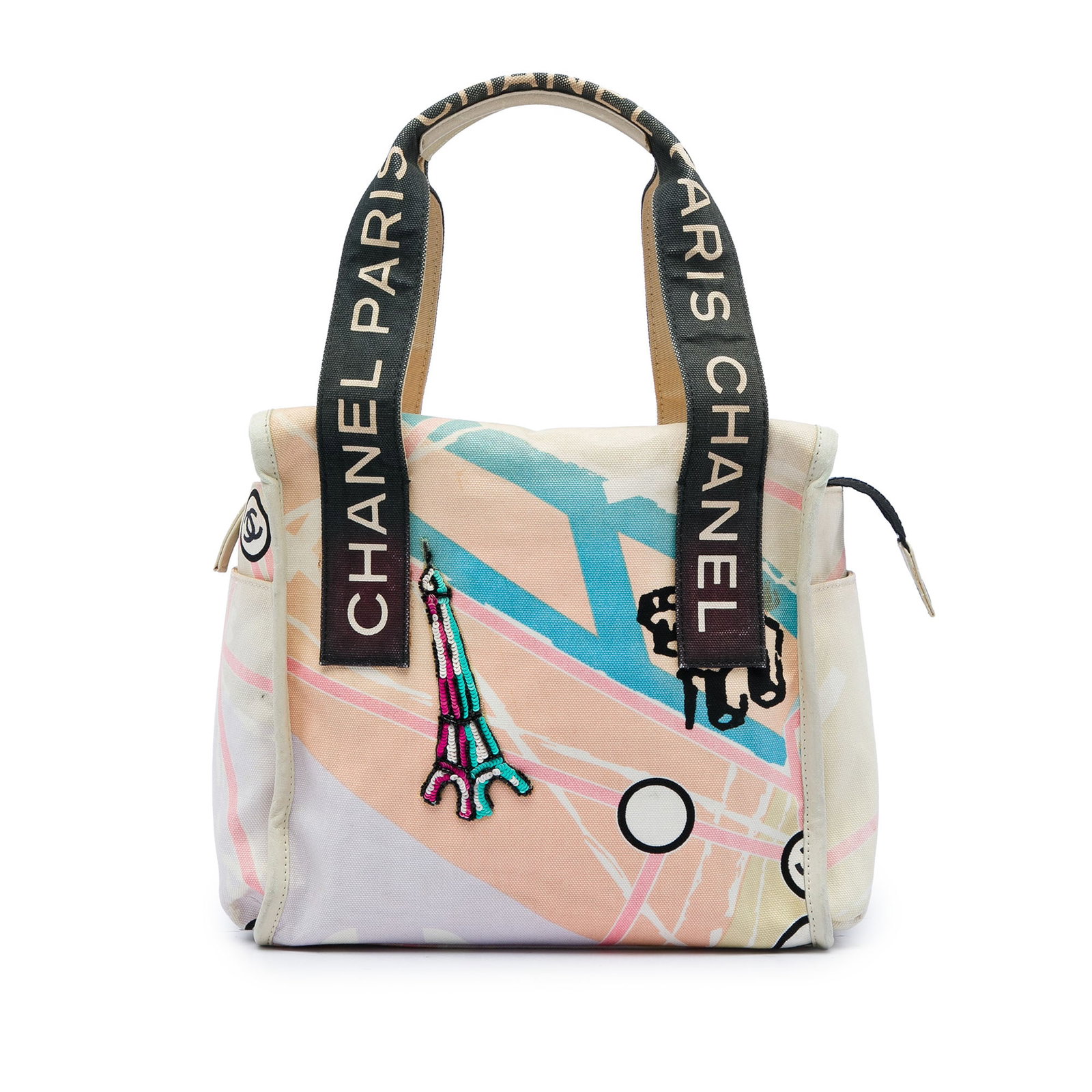 Chanel Eiffel Tower Canvas Shoulder Bag Beige: Chanel Eiffel Tower Canvas Shoulder Bag Beige Chanel Canvas Eiffel Tower Handbag in beige fabric with a printed canvas body, exterior slip pockets, flat straps, a top zip closure, and an interior zip 