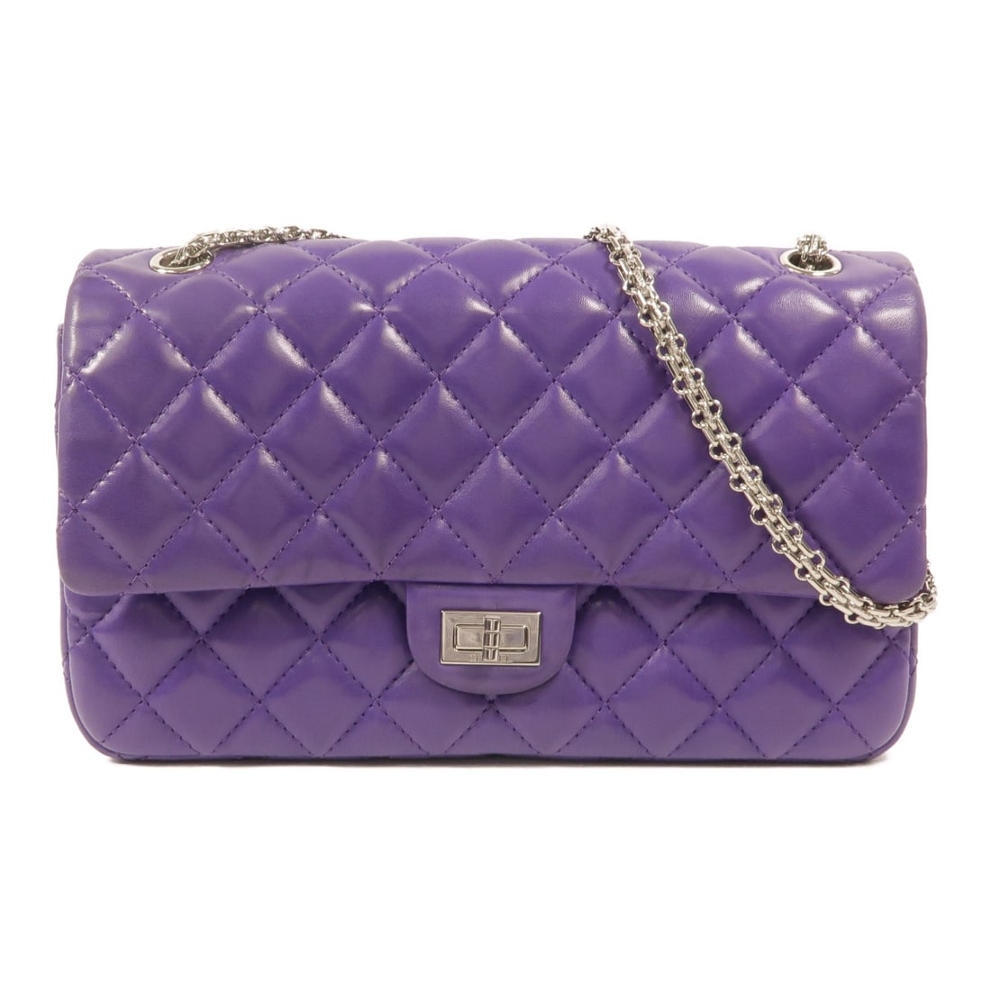 CHANEL 2.55 Purple Lambskin Shoulder Bag with Chain SHW: CHANEL 2.55 Purple Lambskin Shoulder Bag with Chain SHW A Chanel 2.55 chain shoulder bag in purple lambskin leather with CC turn-lock closure and silver-tone hardware. This women's shoulder bag featur