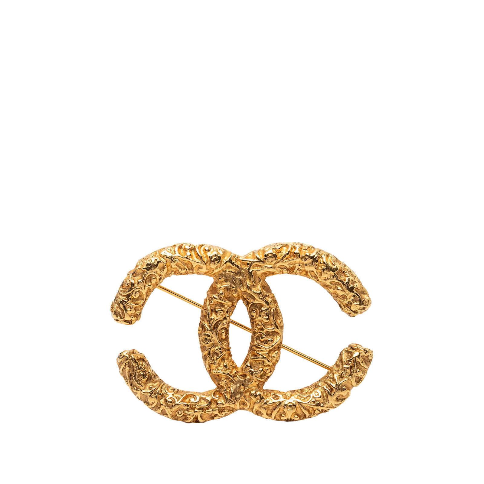 Chanel CC Baroque Embossed Gold Plated Brooch: Chanel CC Baroque Embossed Gold Plated Brooch Chanel CC baroque embossed brooch in gold-plated metal with a back pin closure. Made in France, this costume jewelry piece features visible wear including