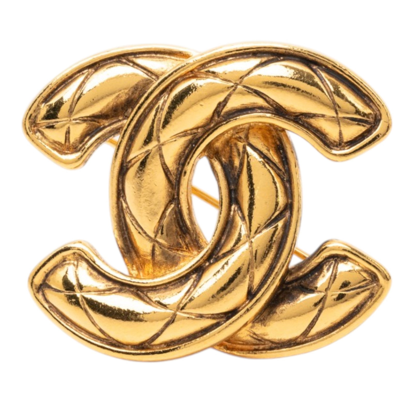 Chanel CC Quilted Gold Plated Metal Brooch: Chanel CC Quilted Gold Plated Metal Brooch Chanel CC quilted brooch in gold plated metal with a back pin closure. Includes box. Condition is B+ with scratches to the front, back, and lock. Specificati
