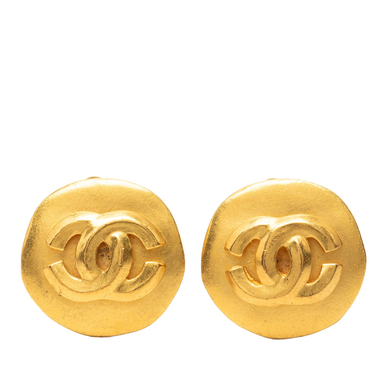 Chanel CC Round Clip On Earrings Gold Plated Metal: Chanel CC Round Clip On Earrings Gold Plated Metal Round clip-on earrings with Chanel CC styling in gold plated metal. Made in France, this costume jewelry pair features clip back closures. Condition 