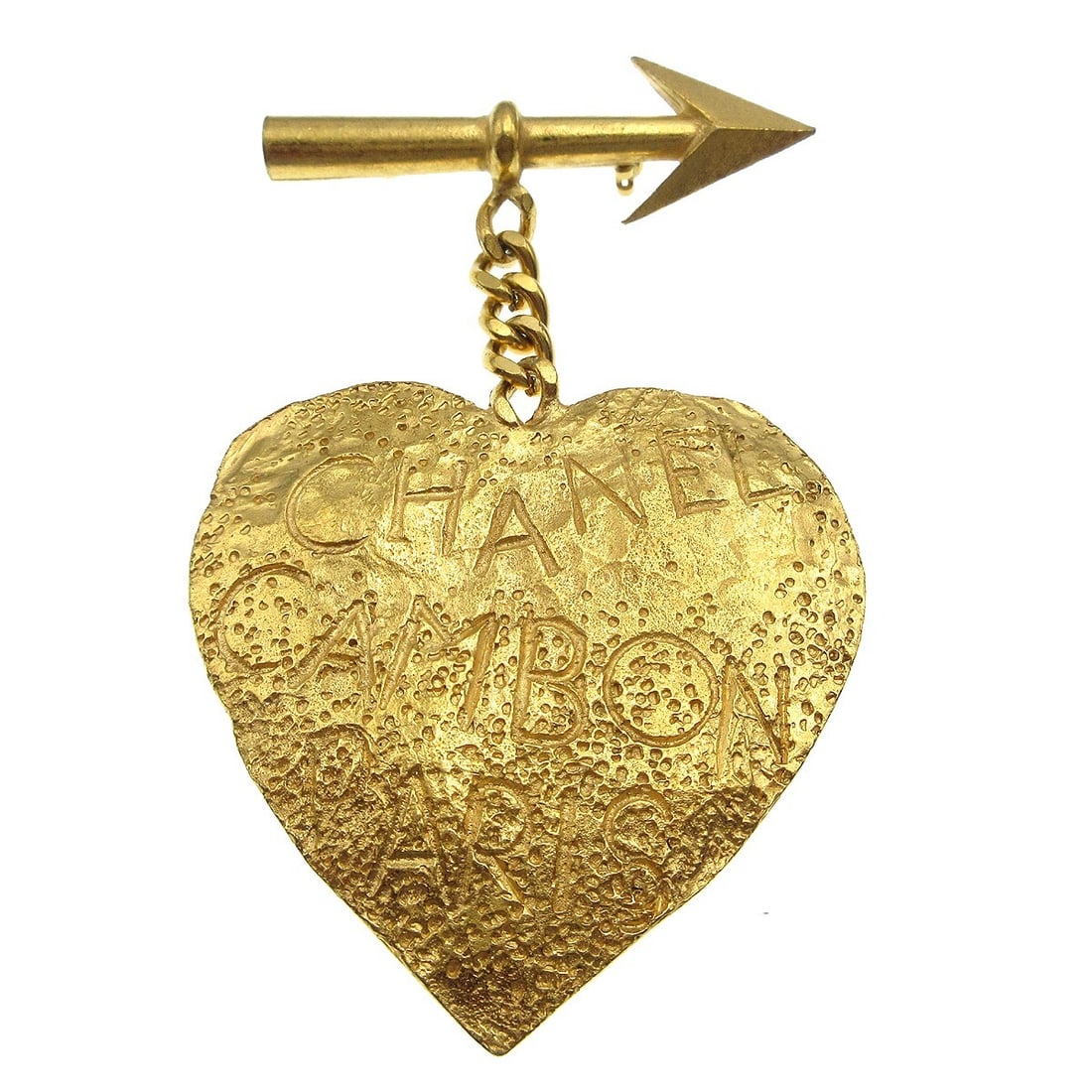 Vintage Chanel 93P Gold Tone Heart Arrow Brooch: Vintage Chanel 93P Gold Tone Heart Arrow Brooch Vintage Chanel brooch featuring a heart motif with an arrow design in a gold-tone finish. Made in France, this piece includes the original box and prese