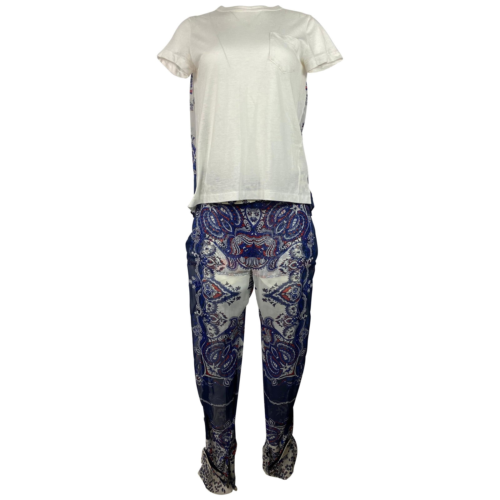 Sacai floral top and pants outfit set in white blue: Sacai floral top and pants outfit set in white blue A Sacai suit set featuring a white short sleeve top and matching pants with white, blue, and red floral details. The top has a crew neck, front pock