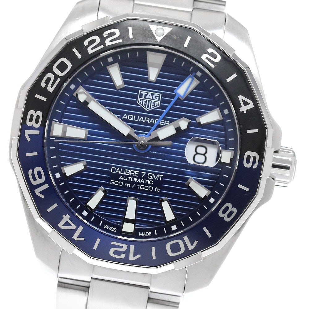 TAG Heuer Aquaracer WAY201T Caliber 7 GMT Mens Automatic Watch: TAG Heuer Aquaracer WAY201T Caliber 7 GMT Mens Automatic Watch TAG Heuer Aquaracer Caliber 7 GMT automatic men's wristwatch with a blue dial, stainless steel case, and stainless steel bracelet. This w
