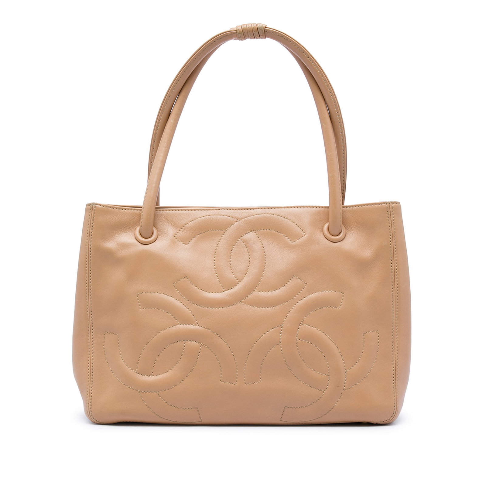 Chanel Triple CC Lambskin Tote Bag Beige: Chanel Triple CC Lambskin Tote Bag Beige Chanel Lambskin Triple CC Tote in beige lambskin leather with rolled leather handles, an open top with magnetic snap closure, and interior zip and slip pockets