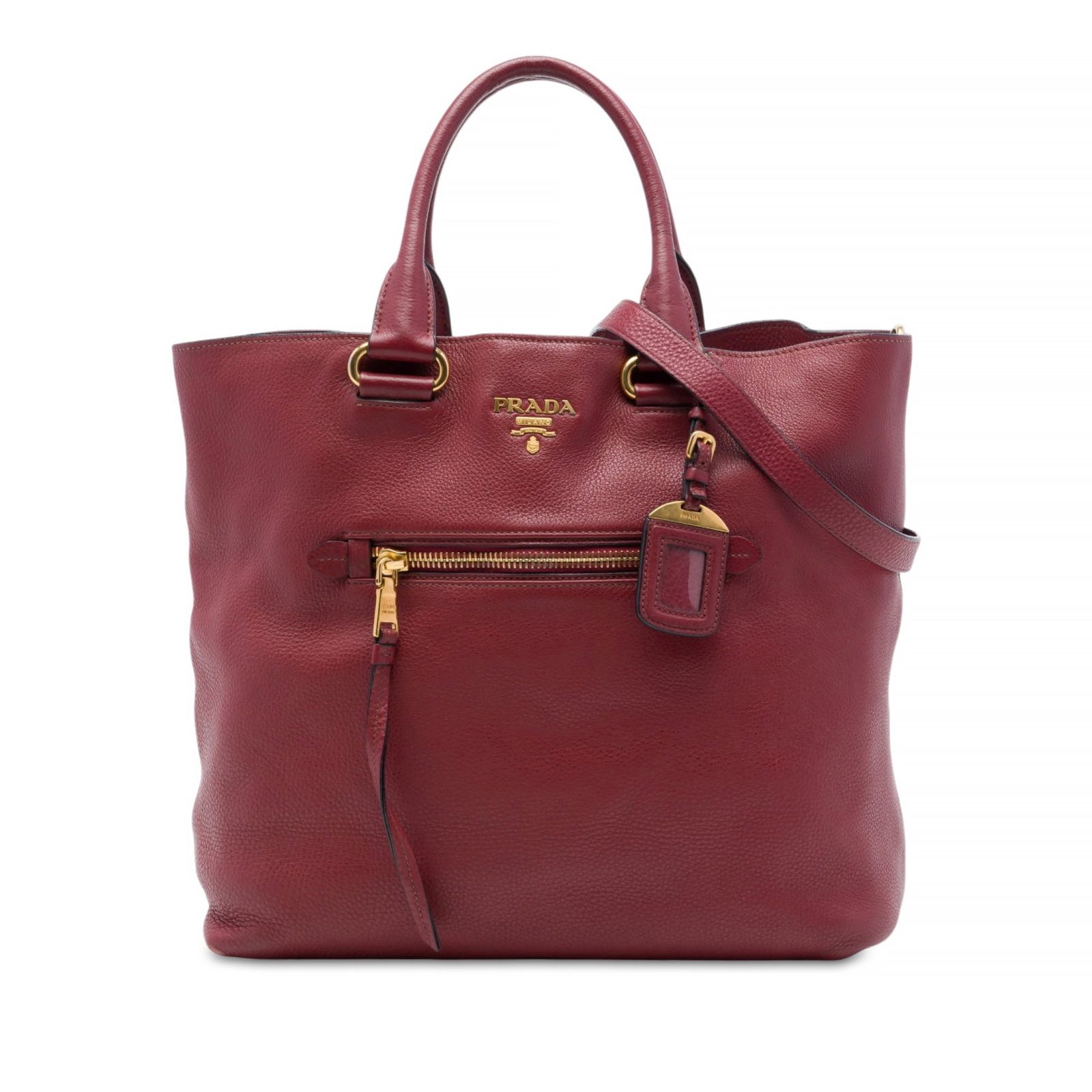 Prada Vitello Daino Red Leather Satchel with Shoulder Strap: Prada Vitello Daino Red Leather Satchel with Shoulder Strap A Prada Vitello Daino Open Convertible Tote in red grained leather with a structured satchel silhouette. It features rolled leather handles,